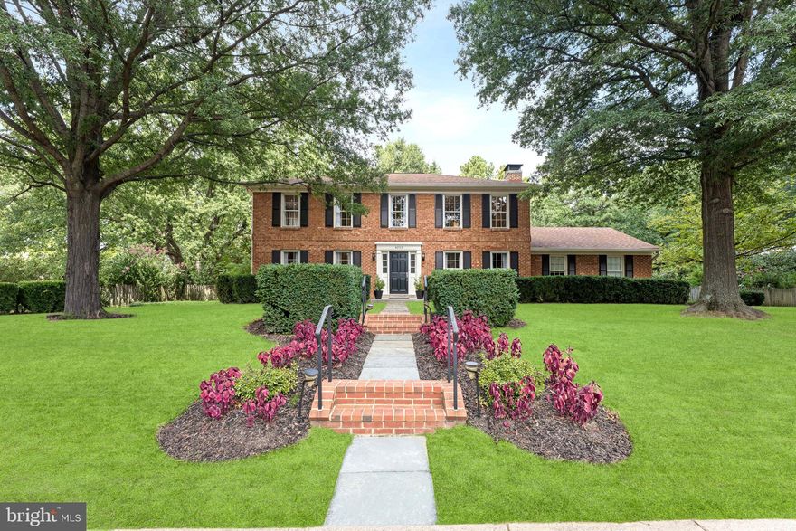 Discover tranquil living in this beautifully-maintained brick colonial, situated on a quiet cul-de-sac in Seminary Hill that backs up to serene forest views. This stunning 4-bedroom, 2.5-bathroom home sits on a private, rarely available half-acre flat lot adorned with gorgeous landscaping and majestic old-growth trees that provide natural beauty and privacy year-round. 

Enter through the gracious foyer into beautifully appointed living spaces, including formal living and dining rooms ideal for entertaining. The thoughtfully designed main level features a convenient half bath, a mudroom with a new washer and dryer plus built-in storage, and a bright breakfast area off the kitchen—complete with all new appliances—that opens directly to the rear patio. A cozy family room highlights a striking full wall of stonework centered by a warm hearth.

For ultimate relaxation, retreat to the expansive primary suite, complete with its own newly renovated ensuite, sitting area, and large walk-in closet. Three additional spacious bedrooms and a full hall bathroom, recently remodeled with a double-vanity, round out the upper level. 

Modern conveniences enhance everyday living throughout, combined with new low-maintenance gutters. The sizeable attached 2-car garage offers convenient parking, while the large unfinished basement provides abundant storage or exciting potential for expanding your living space. Outdoors, the fully-fenced flat backyard is a private oasis with ample room for recreation, gardening, or relaxation.

This home is perfectly positioned for convenience, offering a quiet residential feel with easy commuting via I-395. You'll enjoy close proximity to King Street Metro, Old Town Alexandria, Shirlington, and the Pentagon, with a quick commute to DC. This exceptional home offers the perfect blend of natural serenity, elegant design, and modern functionality in a truly special setting.