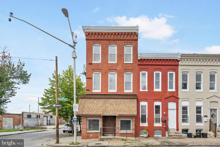 End-of-group mixed-use brick-front rowhome with income potential and charm! The main level is set up for a deli or restaurant, fully equipped and ready to go—with a convenient powder room for staff and guests. Upstairs, the residential space offers an open layout with a spacious kitchen, island prep area, and room for both dining and entertaining. Natural light floods the living area through large windows. A bedroom, full bath with tub/shower combo, and laundry room complete this level. The top floor features two generous bedrooms and another full bath. Live upstairs and run your business below—or rent out one or both units for additional income! Prime location near Reservoir Hill, Druid Hill Park, Route 40, and I-83.