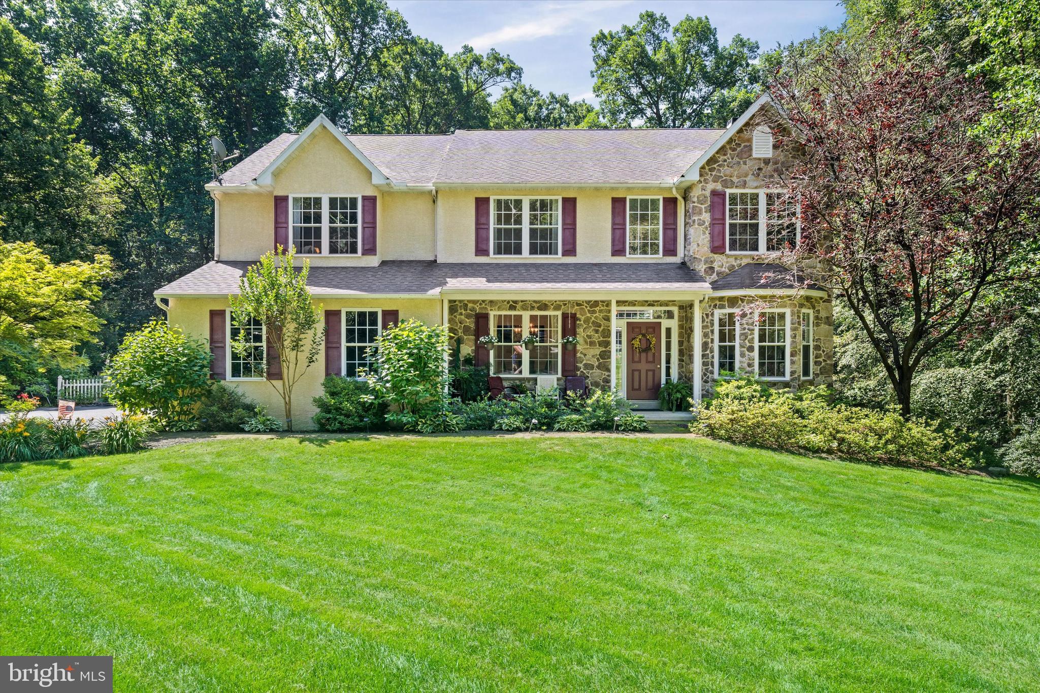Tucked away on a picturesque 2.83-acre wooded flag lot, this beautiful home offers the ideal blend of privacy, nature, and convenience—just minutes from shopping and amenities. A long driveway leads to this secluded property, where you'll find extensive gardens, a charming fenced vegetable garden, and a garden shed adorned with window boxes. A welcoming front porch and sidewalk entry open to a two-story foyer with hardwood floors that flow throughout the main level. To the left, is a formal dining room, while pocket doors to the right reveal a private office with luxury vinyl wood floors—ideal for working from home. The heart of the home is the two-story family room, which opens to a spacious eat-in kitchen featuring stainless steel appliances, a breakfast bar, generous cabinetry, and a sliding glass door leading to a large deck with serene views of the beautifully landscaped grounds—perfect for entertaining or relaxing. An oversized laundry room includes built-in cabinets, a utility sink, and ample counter space. Upstairs, double doors lead to a spacious primary suite with his and hers walk-in closets and en suite bath complete with a double vanity, soaking tub, and separate stall shower. Three additional bedrooms and a hall bath complete the upper level. The luxury vinyl wood hallway overlooks both the foyer and family room, adding to the open, airy feel. The full walkout basement is ready to be finished and already includes premium features: soaring 9' ceilings, an additional I-beam to minimize support posts, rough-in plumbing for a future bathroom, and sliding doors to a rear patio.
Additional highlights include a drip irrigation septic system compliant with South Coventry Township regulations. Don’t miss your opportunity to enjoy peaceful, private living with all the space and comfort you’ve been looking for—schedule your private tour today!