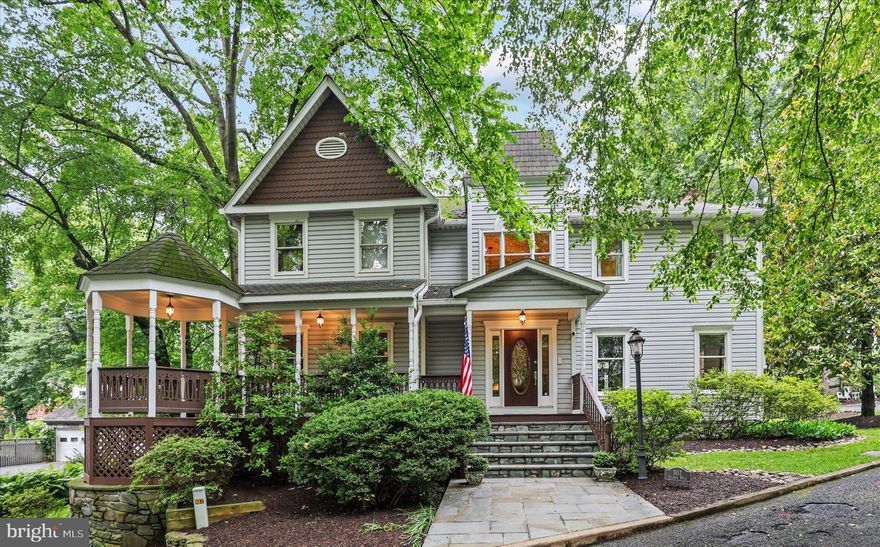 Nestled in a private, landscaped oasis in sought-after Falls Church City, on a quiet cul-de-sac, this *GORGEOUS* 6-bedroom, 3.5-bath Victorian home offers the perfect blend of timeless charm and modern luxury across three fully finished levels. Just minutes from the East Falls Church Metro, the Falls Church Farmers Market, and top-rated Falls Church City schools, the location boasts both privacy and convenience (and a high WALK SCORE). Inside, you'll find a grand two-story foyer, elegant living and dining rooms with custom details including crown molding, a crystal chandelier, and marble fireplace mantels. The gourmet island kitchen features granite countertops, Sub-Zero and GE Profile appliances, a skylit eat-in area, and an adjoining mudroom. A sunny family room with windowed turret, built-ins, wet bar, and fireplace adds warmth and character, while a main-level office (or sixth bedroom) offers flexibility. The primary suite is a luxurious retreat with a fireplace, walk-in closet, sitting area, and spa-inspired bath with frameless shower, marble tile, and dual vanities. Additional spacious bedrooms, a full hall bath, and a beautifully finished lower level with a rec room, wet bar, extra bedroom, full bath, laundry, and storage complete the interior. With fresh paint, a two-car detached garage, and high-end updates throughout, this move-in ready home is an exceptional opportunity in the heart of Falls Church City!