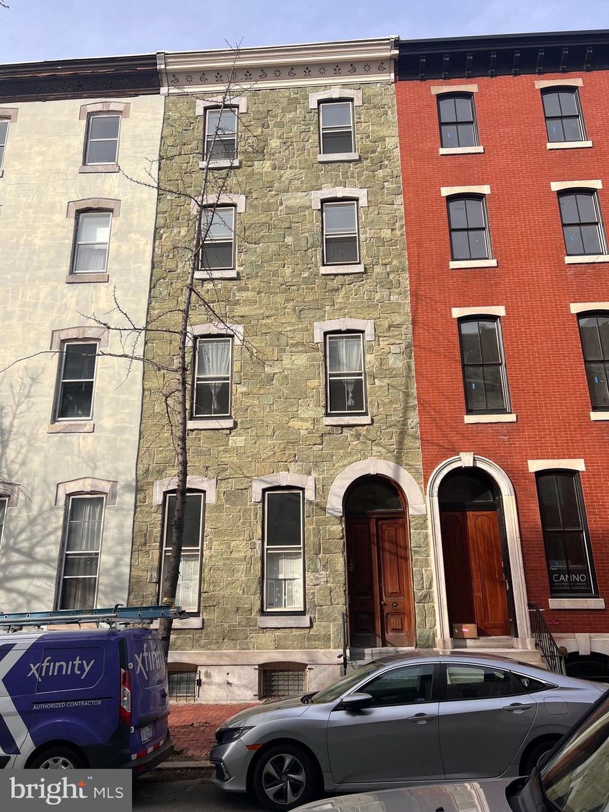 More photos to come. Spacious townhouse located in Fitler Square neighborhood with two car gated parking. Three units. Unit one is located on the first floor, back of the second floor and the lower level with 3 bedrooms and 3.5 bathrooms. Unit 2 features one bedroom, one bathroom on the second floor front. Unit 3 is a three bedroom and one bathroom unit located on the top two floors.  All units have their own washer and dryer.  Some original details, high ceilings, partial finished basement.