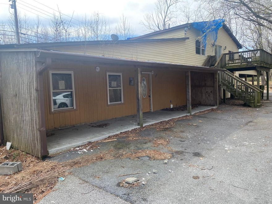 3+ acre lot with house 4 Bedrooms 2 Bath,with long around about driveway can take 10 cars.Perfect for your new compound! Tons of flat land already cleared!it is minutes to your choice of stores, shopping, restaurants entertainment venues, view miles from Chesapeake Beach Property needs work and being sold strictly ‘as-is’. Seller will make no repairs or perform inspections. Listing Broker and Seller assume no responsibility and make no guarantees, warranties  or representations as to the availability or accuracy of the information contained herein.