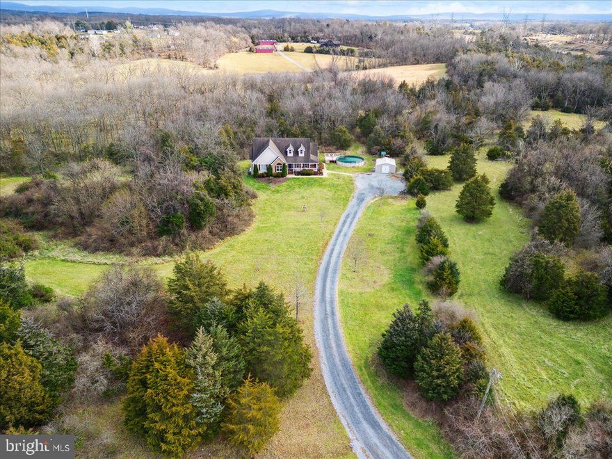 Welcome to your own slice of paradise in this charming Cape Cod style home nestled on 6.34 acres within a private-gated community that has access to Opequon Creek. With 3 bedrooms and 2.5 bathrooms, this residence provides a perfect blend of comfort and style. The property has been meticulously maintained, featuring a brand-new HVAC system and water heater for modern convenience. Additionally, there's a geothermal hookup available, showcasing the commitment to energy efficiency and sustainable living. The UPDATES INCLUDE:  Freshly painted in Dec, 2023, New heat pump and air handler July 2023, New 80-gallon water heater July 2023, All stainless steel kitchen appliances replaced between 2021-2023, and New pool and pool deck installed in 2022. The HOA does allow horses and non-commercial livestock. Less than 15 minutes from I-81, main commuter routes , Spring mills Schools, grocery and entertainment.

Don't miss the chance to make this Cape Cod retreat your home. Experience the perfect blend of modern comforts, outdoor serenity, and timeless style in this unique property. Schedule your private viewing today.