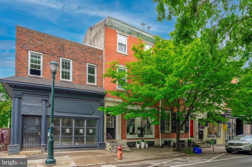 A unique opportunity to own  a fully occupied 4-Unit Commercial storefront, Street to Street building on Washington Square Park West!  This three story building comprises a recently renovated 1st floor commercial retail property on Pine St,  which is currently a successful ladies clothing store. There are three apartments which are accessed from a courtyard, at the rear of the building in Waverley St. The property is directly across the road from the neighborhood Louis Kahn Park.
The first floor rear apartment is a large bi level with 2 bathrooms, the 1st floor has a kitchen living room and a bathroom, the upper level has a huge bedroom and den with original hardwood flooring. This upper level has a door which conveniently has access to the inner building staircase.  There is a further one  rear 3rd floor apartment with a very large bedroom with ceiling beams and also original wood floors .
The second bi level apartment overlooks Pine St with a galley kitchen,  a very large living room with a spiral staircase leading to an extremely spacious bedroom with a full bathroom. The upper level of this apartment also has a door which opens to the central inner staircase. The apartments and the entire property is in wonderful condition and fully occupied.