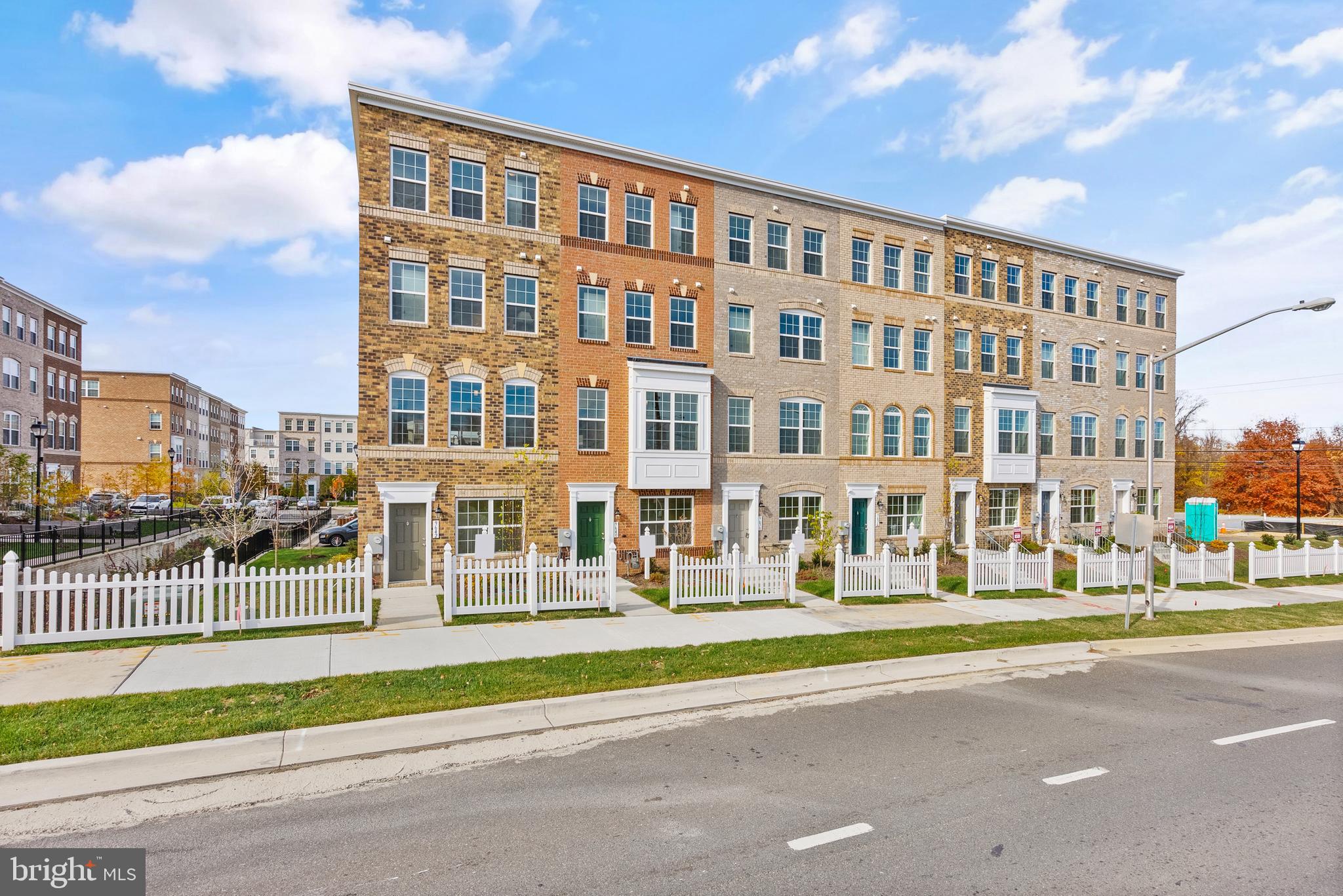 IMMEDIATE DELIVERY. Full Brick Front 4-Level Urban Towns with 2 Car Garage. END UNIT. Skytowns 42 Model. Upgrade Floors on the entire Main Level. Composite Deck, Rooftop Terrace, large 10-foot Kitchen island, Fireplace, Owner's Soaking Tub, Two Owner's Closets, 3 Bedroom, 3 Full and 1 Half Bath, Stainless Appliances, Quartz counters in Kitchen, Gourmet Kitchen with 5-burner Cooktop and Double Wall Ovens, Ceramic Tile Baths, Upgrade Cabinets with Crown Trim. Seller offering $18,000 TOWARDS CLOSING.