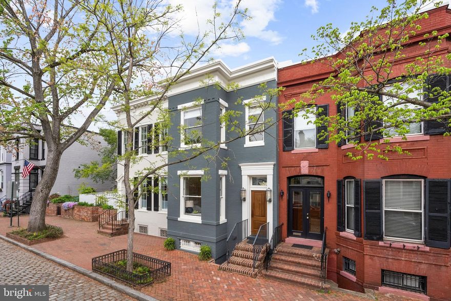 COMING SOON | This exceptional Georgetown West Village 4 bed, 3.5 bath with 2 car garage residence is the result of a meticulous stud-to-stud renovation led by architect George Gordon, designer Darryl Carter, and builder Dave Richetti, where every material, fixture, and finish was selected with intention. The home unfolds with quiet sophistication, balancing historic character with a distinctly modern point of view. The kitchen, both sculptural and highly functional, features Bulthaup cabinetry paired with Ann Sacks tile, a Gaggenau refrigerator, Miele coffee and espresso system, and Bosch appliances, creating a space equally suited to daily living and elevated entertaining. Throughout the home, curated details define the experience: Waterworks fixtures and custom millwork integrate seamlessly with restored architectural elements. The dining room, reimagined with a wall of glass and bespoke built-ins, offers a flexible space for gathering, working, or retreat. Upstairs, the primary suite serves as a private sanctuary, with a fireplace and a spa-inspired bath wrapped in Ann Sacks marble, featuring a Waterworks double shower and radiant heated floors. Secondary baths continue the design narrative with Hansgrohe systems and Philippe Starck fixtures. The lower level extends the home’s versatility, with beautifully finished space for guests, work, or wellness, complemented by a bath with Restoration Hardware marble. Outdoors, a serene, designed patio offers privacy and ease, while the rare detached two-car garage, fully wired and plumbed, presents a unique opportunity for future expansion. Finished in Farrow & Ball paint and supported by comprehensive mechanical upgrades, including new windows, roof, HVAC, water heater, generator, dehumidifier, boiler, comprehensive drainage system, and a security system with remote access, this home pairs timeless design with modern infrastructure, all set on a quiet cobblestone street in one of Georgetown’s most desirable locations.