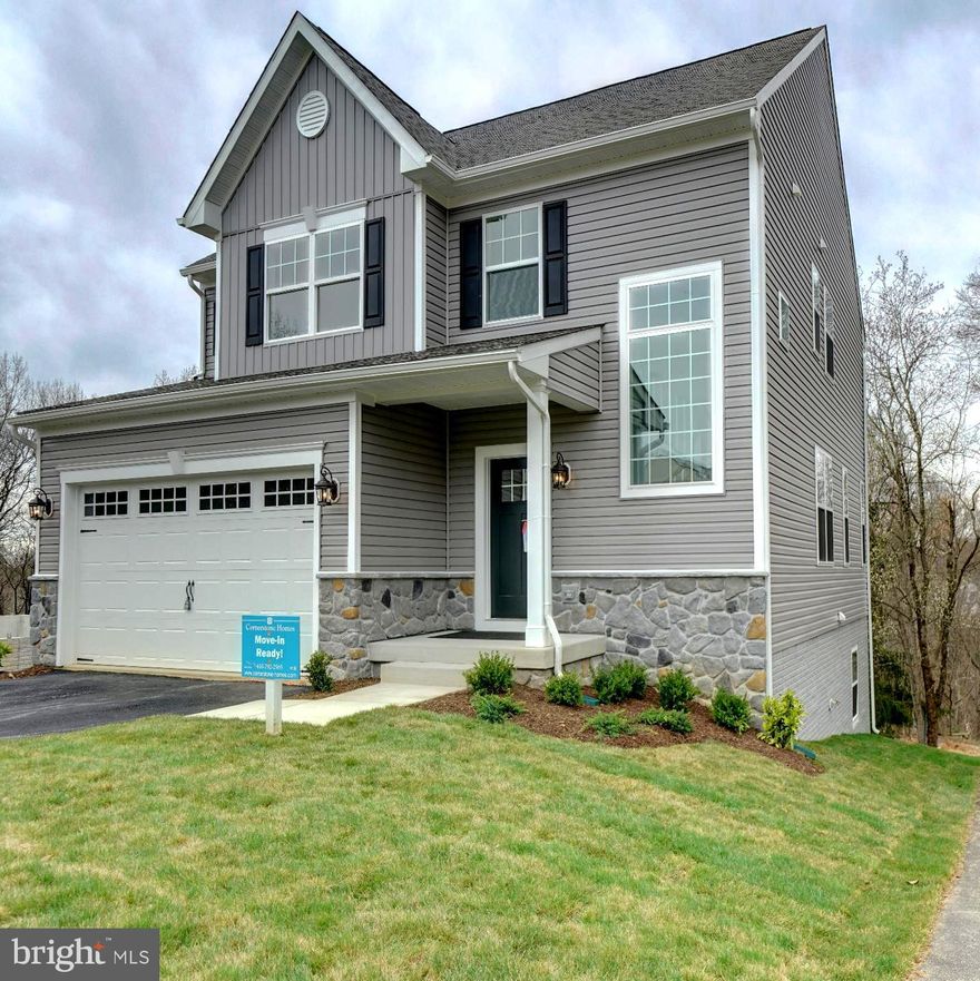 Section II of Cornerstone Homes in Fairview Woods is now available with 2 different floor plans to choose from. Fairview Woods is Cornerstone Homes' new development in Southern Howard County. Minutes to major Rts I95, 32, or MARC lines. Convenient to FT MEADE/NSA, JHUAPL and BWI. A short distance to Burtonsville, Columbia or Maple Lawn for shopping and restaurants. This wonderful enclave of new homesites are located at the end of Fairview Avenue; backing to Howard County Parks & Rec protected land with views of the Patuxent River! Walking distance to High Ridge Park with trails, tennis, pickleball, tot lot and other rec facilities. Model home features 5 Bedroom 3.5 Bath craftsman with 2 car garage. Dreamy kitchen with walk-in pantry, large breakfast island, soft close, painted wood cabinets with Quartz countertops. A full complement of SS appliances with designer Hood Vent (vented to outside). This popular Claremont model home has a light and airy floor plan with extra-large windows added throughout and plenty of recessed lighting.
Modern design with special features include board and batten accent siding, partial stone exterior, with a covered front porch and a Trex deck with white vinyl rails. Inside the builder included a finished lower level with 9' ceilings, a 5th bedroom, a 3rd full bath and a true walk-out slider to the rear yard. Additional Features worth noting are the premium trim package
(Main Stairwell, Great Room and Flex Room) and the designer vanity cabinet in the first-floor powder room. All the flooring is upgraded; including LVP throughout the main level and stairs up, upgraded pad in the upper and lower carpeted rooms. Deluxe Tile Package in the baths and a tiled backsplash in the kitchen. Primary suite with huge walk in closet, cathedral ceiling and windows with a beautiful wooded view. The En-Suite Bath features a luxurious tiled shower with glass doors, double vanities and a double door linen closet in the bathroom. Upper level laundry room is a wonderful convenience Spacious 2 car garage from a paved driveway with room for 4 more cars. Electric rough in for EV cars is included. Contact builder for details of an exclusive incentive package. Private tours available. NOTE: Some photos are of the model with virtual staging. Call for your appointment today!!