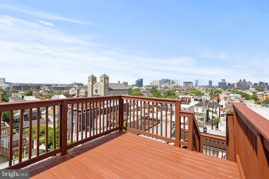 This beautifully renovated and enormous four bedroom with three and a half  bathrooms townhome sits right at the top of a hill in Upper Fells Point offering sweeping city-skyline views from the third story roof deck. Enter through the front door into the living room and walk to the back of the home past the floating stairs, half bathroom, and dining area to reach the kitchen on the back of the home. The open floor plan here at 308 S Collington AVE. makes entertaining seem effortless. There is a deck off of the back of the kitchen giving outdoor space to the main level. Up the floating stairs to the second level you will find a bedroom with a full bathroom within the bedroom and to the left a hidden washer and dryer (side by side), full hallway bathroom, and another generously sized bedroom. Up to the third level there are two large bedrooms, a full bathrooms, and two tier roof deck acces where you will find yourself gazing upon one of the most magnificent views of charm city skyline and the harbor. Highlighted finishes include hard wood floors throughout, modern finishes and fixtures, a dual zoned HVAC system that heats and cools the entire home effortlessly, granite countertops, custom trim and paint package,  stainless steal appliances, and 2,000 square feet of living and entertaining space. This home is located five minutes away from OâDonnell Square and six minutes from the Harris Teeter/ Target shopping center. This one won't ask long!