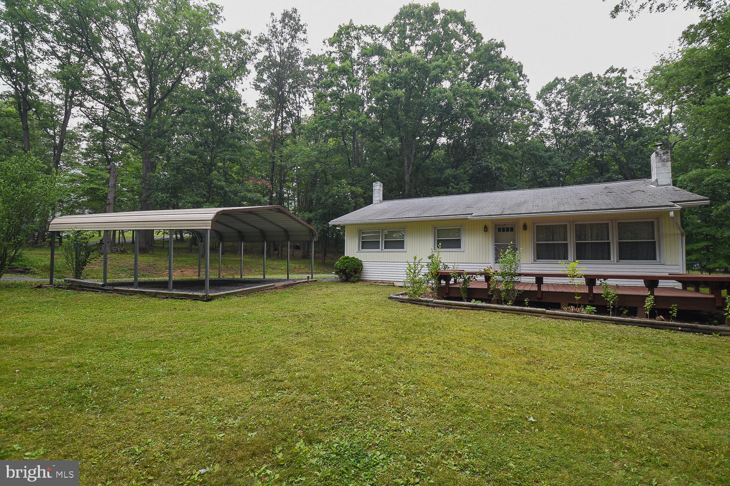 ROOM TO ROAM!! Close to town but out of the city limits sits this 3 bed / 1 bath rancher on OVER TWO ACRES!! Full unfinished basement, carport, rear covered porch, front deck, storage shed, wood stove and MORE! Come check it out, before it's GONE!
