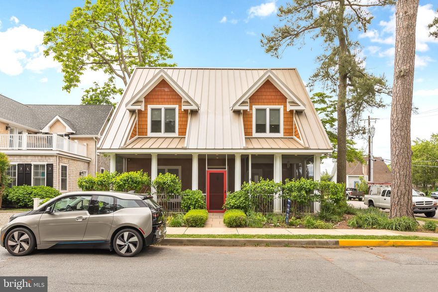 This house was designed using passive house principles and is one of a kind in Rehoboth Beach!  What is a passive house? A passive house is a construction concept that is truly energy efficient, comfortable, affordable and ecological at the same time.  This 3 bedroom 2.5 bath house with 2 screen porches, a 2nd floor deck and a fantastic patio with lovely gardens was designed by architect, Paul Gaiser, AIA, and has all of ecological bells and whistles!  Features include: 4.4 kwh solar panel system with SRECS, French drain around the house that goes to a 1800 gallon cistern for irrigation, Triple-paned hurricane windows (INTUS windows – European style), Radiant floor heat that is glycol (much more efficient than wire web), Level 2 electric car charger, Racine 50 year metal roof, Whole house sprinkler system, Energy Recovery Ventilation, Reclaimed oak wood floors, Reclaimed wood (from grandfather’s barn) on ceiling in bedrooms, Reclaimed bedroom entry antique doors with transoms, Two hot water heater systems that produce instant hot water, Energy Star appliances, Automatic room darkening shades in primary bedroom, First floor is wheel chair accessible.  Did I mention, pick blueberries and peaches from your yard!
Just 5 blocks to the beach and boardwalk and 2 blocks from the Rehoboth Beach Farmers Market that is rated #1 in the state of Delaware!