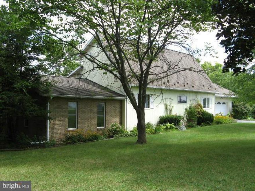 Acreage - room for your animals - two metal buildings and 1 block loafing shed for livestock and storage - with fencing.  3 Bedroom 2 Baths - Living room fireplace has wood stove insert. Den/study area for book shelves, desk and computer. Table area in kitchen and separate dining room. Sunroom for relaxing. Sitting areas and many closets. Separate laundry/mud room. Call today for an appointment.