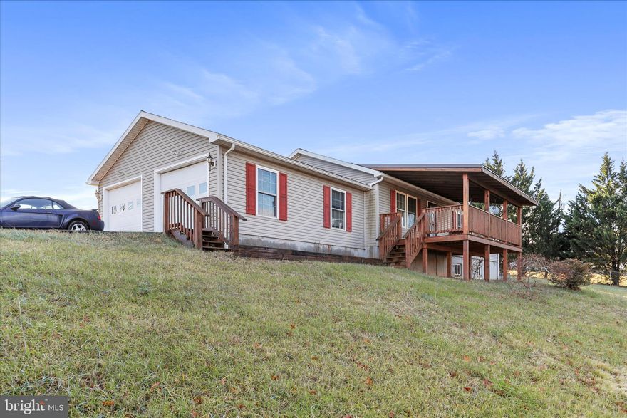 Welcome to this charming 3-bedroom, 2-bath rancher situated on approximately 1.5 acres in a rural setting. Perched on a gentle rise, the home enjoys a nice sense of elevation and surrounding countryside views. The single-level layout offers comfortable living with a functional floor plan: a living room and an eat-in kitchen that opens to the dining room area. Access to the back deck to enjoy the surrounding countryside. 
The primary bedroom includes an attached bath with a soaking tub/shower combo and double sinks. Two additional bedrooms and a full hall bath complete the main level. 
A full, unfinished basement provides ample storage or future expansion and includes walkout stairs to the yard. The home is being sold as-is and would benefit from updates and some repairs. A solid opportunity for buyers looking to personalize and create value. 
Nearby Cacapon State Park and Sleepy Creek nature preserve provide outdoor recreation. Schedule your showing today!