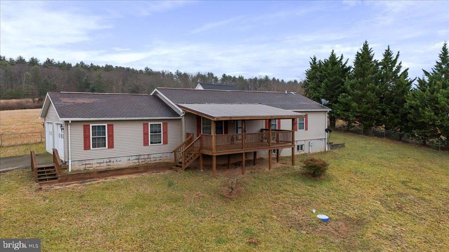 Welcome to this charming 3-bedroom, 2-bath rancher situated on approximately 1.5 acres in a rural setting. Perched on a gentle rise, the home enjoys a nice sense of elevation and surrounding countryside views. The single-level layout offers comfortable living with a functional floor plan: a living room and an eat-in kitchen that opens to the dining room area. Access to the back deck to enjoy the surrounding countryside. 
The primary bedroom includes an attached bath with a soaking tub/shower combo and double sinks. Two additional bedrooms and a full hall bath complete the main level. 
A full, unfinished basement provides ample storage or future expansion and includes walkout stairs to the yard. The home is being sold as-is and would benefit from updates and some repairs. A solid opportunity for buyers looking to personalize and create value. 
Nearby Cacapon State Park and Sleepy Creek nature preserve provide outdoor recreation. Schedule your showing today!