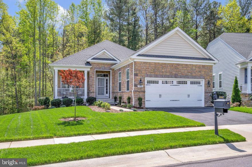 Welcome to your serene retreat in the heart of Virginia Heritage, an exclusive gated community catering to the active lifestyle for those 55 and above. This beautifully crafted, very well maintained home offers the perfect blend of comfort, modern conveniences and natural beauty. The homes full stone facade, lush
landscape and covered front porch invite you in. Beautiful tray ceilings in the dining and living areas,
engineered hickory flooring throughout the entire first floor and expansive windows framing private views of the forest beyond. The owners suite also boasts elegant tray ceilings and large windows with the same breathtaking views. The best in main floor living with an open concept plan. Seamless indoor/outdoor living with a 26 ft screened deck as well as an additional outside deck and stairs to the stamped concrete walk/patio below. Smart home features include Lutron Caseta dimmers and timers as well as Decora style rocker switches, Baldwin smart door lock, ring doobell, Rainbird intelligent sprinkler system. The newly expanded lower level provides privacy for your guests with a huge rec room, bedroom and full bath. 310 sq ft of storage finish off this gorgeous wooded walkout home. A second water meter is provided for outdoor irrigation saving hundreds. Leaf filters on all gutters and underground drainage. Easy access shopping, dining, healthcare and more. The pictures say it all. This home is truely as nice as its photos! Don't miss out..schedule your showing today!