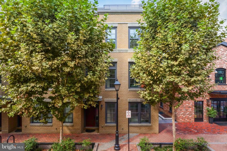 Rare opportunity, water views and effortless living in this pristine townhome in the sought-after Robinson Landing community along the Old Town Alexandria vibrant waterfront. Basking in natural light, this stunning home features expansive windows with water views throughout. With a modern, stylish design, the flowing floorplan offers four spacious bedrooms, four and a half baths, with master bedroom ensuite bath and large walk-in closets.  The open-concept kitchen features, Thermador and Bosch appliances, microwave oven drawer, quartz counters, soft-close custom cabinetry, marble backsplash, large pantry, dining and living area with gas fireplace and balcony off of the kitchen.  Enjoy multiple indoor and outdoor living area options for relaxing and entertaining to include a top-floor family room with wet bar, a rooftop deck with an outdoor kitchen via private elevator to all four floors. All this modern luxury is located in the desirable SE quadrant of Old Town near the waterfront and the restaurants and shops of King Street.  Robinson Landing delivers exceptional premium amenities to included: 24-hour concierge and on-site staff, a state-of-the-art fitness center and yoga studio overlooking the Potomac River, a pet grooming spa, a resident lounge, game room, library and an elegant lobby. Quick access for commuters conveniently located near Amazon HQ2, Capitol Hill, downtown DC and Reagan National Airport.  Whether taking in the river views while dining on the roof deck, or indulging in the abundant amenities, this is ultimate luxury living designed to elevate your daily life experience.