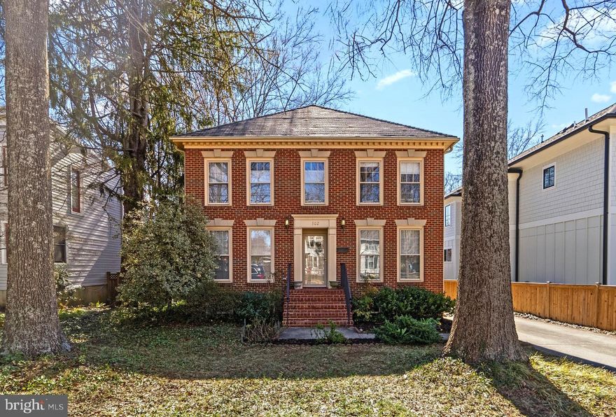 Welcome to 302 North Oak Street, a charming brick Williamsburg colonial in the heart of Falls Church City! This lovely 5 bedroom, 3.5 bath home has been meticulously maintained and updated by its owners over the years offering classic charm all within walking distance to top-rated schools, a variety of shops, and many popular restaurants. Inside, you will find a gracious entry foyer flanked by an elegant living room and spacious dining room for formal entertaining. The updated kitchen features white 42” cabinets, granite countertops and a dining area, with open access to the inviting family room and cozy wood-burning fireplace. French doors lead to a generous two-level deck with room to host a crowd. There’s a detached 2-car garage, a large play house or storage shed, and ample driveway space for a basketball hoop or extra parking. Upstairs, the primary suite boasts a walk-in closet and en-suite bath with Jacuzzi tub, while three additional bedrooms share a well-appointed hall bath. The fully finished lower level provides flexibility with another bedroom and full bath, a spacious recreation room, laundry room, and two storage areas. From here, you can easily walk to the Falls Church Public Library, the popular weekly farmers market, multiple parks, the W&OD Trail, coffee shops and grocery stores. Commuting is effortless with quick access to two Metro stations, bike-friendly routes into D.C., and major roadways including I-495, I-66, Route 7, and Route 29, welcome home