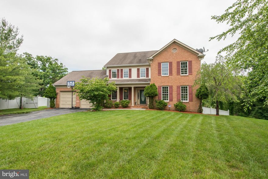 This Fabulous Colonial 6 BDRM Has It All! Main Lvl Offers Fantastic Flow-FR w/ Gas FP, Kit Island w Brkfast Area, LR, DR, BDRM/Office, HWF, Laundry Rm,  Deck. Second floor-4 Bdrms, 4BA, MBR w En Suite Bath. Walkout Bsmt, w/ In-Law Suite, 6th Bdrm, Full BA, Loads of Storage. 2 Car Garage. Fenced Back Yard, Backs to Park & Creek. Easy Access to ICC, Metro, Shopping. Est 1st Yr Taxes $7335.44