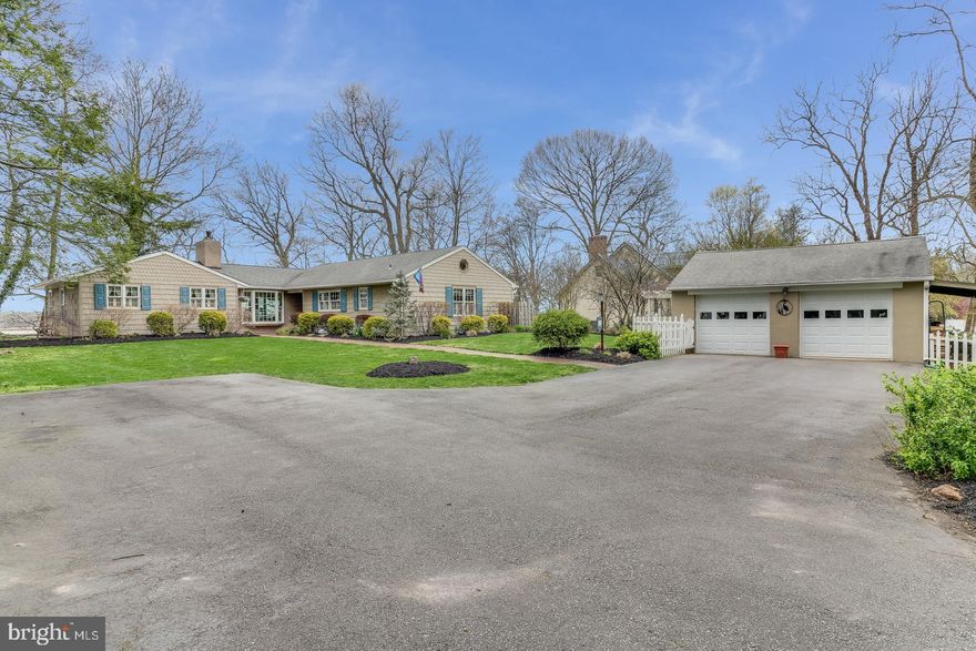 Experience the appeal of a New England cottage in this beautifully updated and expanded ranch home, nestled on the Elk River.  Open floor plan with windows galore, providing excellent water views from the kitchen, living room, three season sunroom as well as the master suite.  Updates include new windows, roof, spacious deck, screened porch and three season sunroom with gas fireplace and coffered ceilings. The kitchen boasts granite countertops, a six burner Viking gas stovetop,  double wall ovens and breakfast bar.  The living room features a wood burning stove, encased in floor to ceiling stone, built-ins, as well as chair rail and crown molding that create a traditional appeal.  Elevated lot overlooking the Elk River has a large dock, yard armed flag pole, and a covered boat slip.  The exterior features a landscaped yard with brick walkways, flower gardens, and a small fish pond.  Large detached two car garage with paved driveway and plenty of parking.  Witness spectacular sunsets from the deck or screened porch.  Move-in condition, plan your tour today for this home will not last on the market.