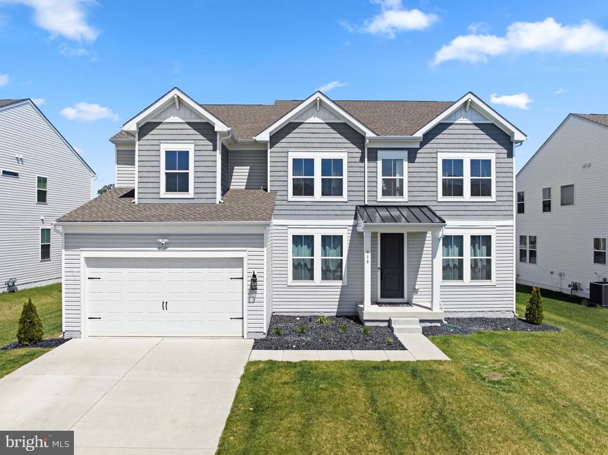 Located in the highly sought-after K. Hovnanian Pleasanton community in the heart of Middletown, this impeccably upgraded Stavanger Farmhouse model seamlessly blends timeless elegance, modern comfort, and everyday functionality. Perfectly positioned just minutes from Weis Market, Target, Sprouts, Chipotle, First Watch, Middletown Main Street, and major commuting routes, including 13, 301, and Route 1, this exceptional residence also offers access to community walking trails, a playground, and a dog park within the award-winning Appoquinimink School District.  Showcasing the coveted Farmhouse interior design package and enhanced exterior elevation, the home welcomes you with striking curb appeal. Inside, thoughtfully curated upgrades and abundant natural light create a warm yet sophisticated atmosphere. The main level features soaring ceilings, luxury vinyl plank flooring, custom living room blinds, a stunning fireplace with hearth, a stylish barn sliding door, and exceptional storage throughout.  At the heart of the home, the gourmet kitchen is designed to impress, featuring upgraded appliances, including a smart Wi-Fi-enabled microwave, a built-in wall oven with air fryer functionality, a modern refrigerator, a dishwasher, a stove, and an expansive walk-in pantry ideal for both entertaining and daily living. A desirable main-level bedroom and full bath provide flexibility for guests, multigenerational living, or convenient aging-in-place accommodations. Upstairs, brand-new carpeting enhances the spacious second level, complete with a thoughtfully located laundry room for added convenience.  The professionally finished walk-out basement offers an extraordinary extension of living space, featuring a private theater room, office, fitness area, play space, extensive storage, and a nearly completed bathroom rough-in ready for future customization.  Designed with both luxury and efficiency in mind, the home also includes tankless hot water and numerous energy-saving features and appliances. Outdoors, enjoy one of the community’s rare oversized, flat, fenced backyards, complete with a playground, a professionally maintained lawn with an irrigation system, and a newly installed Trex deck, creating the perfect setting for entertaining, relaxing, and enjoying outdoor living year-round.  Only available due to relocation, this truly move-in-ready home offers more than $100,000 in premium upgrades and improvements, presenting a rare opportunity to own a beautifully appointed residence in one of Middletown’s most desirable communities.