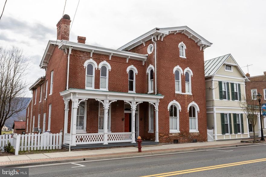 Come Home to History in New Market, Virginia

Step into timeless elegance at the Manor House, a historic 1860 property brimming with character and opportunity. From the moment you arrive, you’ll be captivated by the handsome double-door entrance, grand staircase with banister, built-in cabinets and shelving, and classic wood trim throughout—a true showcase of period craftsmanship.

Offering three levels of living space, the home includes two full baths and a half bath with laundry, blending historic charm with modern functionality. The current owner has invested extensively in updates, including an updated kitchen and a beautifully remodeled primary suite, while leaving room for you to continue the restoration and make the property uniquely your own.

The grounds feature an outbuilding, a large detached garage, and ample parking, providing flexibility and convenience. With its generous layout and central location, the Manor House is ideal for a private residence, restaurant, office space, short-term rental, or inn.

Bring your vision and become the next steward of this remarkable piece of New Market history.