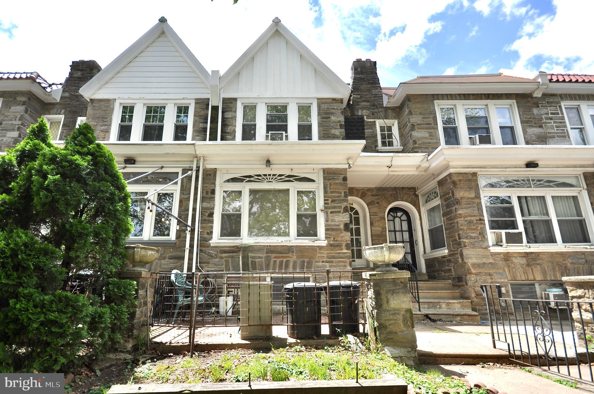 Spacious maintained rowhome with three full bathrooms, one on each floor. Property has original Hardwood flooring, partially finished basement and garage.