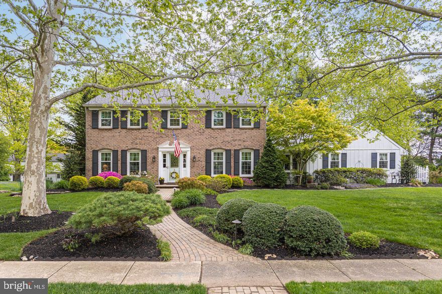 Beautiful colonial located in a wonderful Yardley neighborhood setting in the Pennsbury School System! 552 American Drive has so much to offer. Step right into the bright  foyer that opens to the rest of the home in all directions. The living room offers a private setting that could be repurposed to a home office. A spacious dining room features hardwood flooring and large windows that let in natural light. Perfect for entertaining, the dining room opens to the kitchen, where the hardwood flooring seamlessly continues.  This bright recently remolded eat-in kitchen boasts a garden window, stainless steel appliances, quartz countertops, a center island with additional seating, and both recessed and pendant lighting. Continue into the gathering room, which is the perfect place to either relax around the fireplace with brick hearth, or host family and friends. A large bay window overlooks the front yard, while exposed wood beams and shelves of wooden built-ins accent the space. 
Four panel sliding doors right off of this room open to a lovely screened in porch, leading out to the lush back yard. This main level is complete with a laundry room, and half bath. Upstairs, find the main bedroom with great closet space featuring IKEA closet system, and its own large, remodeled, full bath with Carrera quartz countertops on two vanities, a custom frameless glass shower, Grohe faucets and fixtures, and dimmable lighted antifog mirrors. Three additional bedrooms on this level have access to a full hall bath.  Outside, enjoy the privacy of a fenced -in back yard with beautiful landscaping from the patio. Additional amenities include, new roof,  an oversize 2-car garage, an  Amish built storage shed, automatic sprinkler system, and custom gutter guard system with leaf protection. Newer carpet upstairs and on the stairs, ceiling fans in all bedrooms, Kichler lanterns for front door and garage, front landscape lightening and so much more. In a fantastic location close to shopping, dining, and commuter routes. Don’t pass up your opportunity to make this home your very own!
