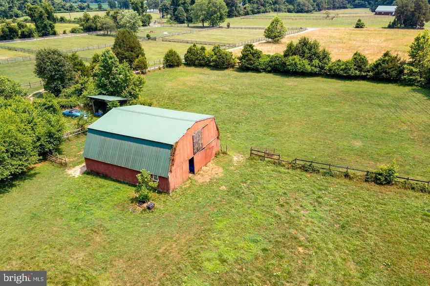9.88 acres with Barn. Perfect lot to build your dream home and already have a barn in place for your horses. Property perked in rear of property in 2004. Perc results are in document section along with an old plat. Take driveway to the right to back of property and barn. Please schedule online for an appointment. Farm has a well seller has solar panel with batteries that the well pump is connected to and well works fine.