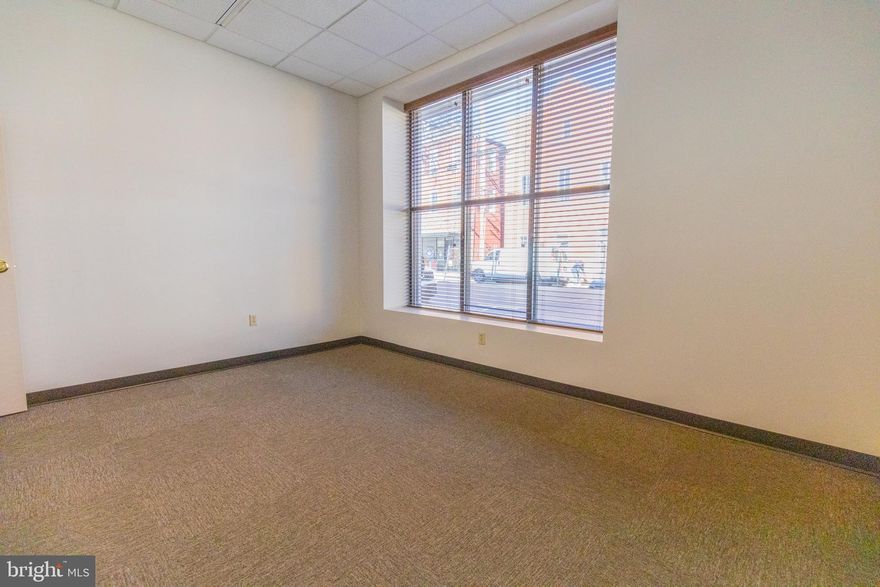 Welcome to Vandalia on Queen in Downtown Martinsburg’s Newest Professional Hub!
Located at 101 S. Queen St, this freshly reimagined office building offers multiple private offices for lease in the heart of downtown, just steps from shops, restaurants, the courthouse, and the city’s growing downtown district.

Each office includes high-speed internet, electric, water/sewer, and mail service, all wrapped into one simple monthly rate. Tenants also enjoy access to two shared conference rooms, a spacious break room, and thoughtfully updated common areas designed for comfort and productivity.

Need more than one office? No problem. Multiple spaces can be leased together for growing teams, small firms, or solo professionals who want a dedicated work area plus an additional meeting or admin space.

A private parking lot is located behind the building, and parking passes are available for just $30/month for tenants who prefer guaranteed off-street parking.

Whether you’re launching a new venture, expanding your footprint, or upgrading from a home office, Vandalia on Queen delivers an affordable, flexible, and modern workspace in a prime Martinsburg location.

Come be part of downtown’s next chapter. Offices are available now and secure your space today!