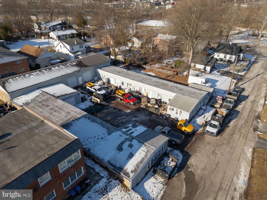 Prime Investment Location . Ideal commercial property consists of  office and warehouse space with a total of 4 -5 different large garage spaces-sections that can be leased to multiple tenants or used by the owner.  Located on a quiet cul-de-sac in a low key section of Norristown,  right near Harding Blvd and half block from the Elmwood Zoo. , The commercial/industrial property offers a great space for light industrial business-contractors/plumbers/electricians etc. Spacious professional office space as well. newer roof, gray siding and back overhead garage doors. Fantastic warehouse space. Ideal for lawn care businesses  as well.  3 separate office spaces, many possibiltles. well maintained. Property is in good condition.
