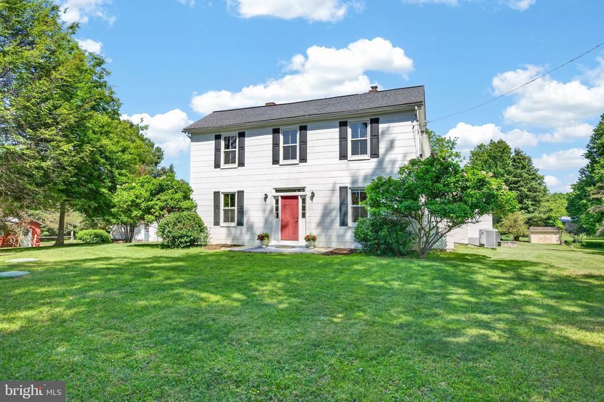 Step into a piece of history in this 4 bedroom and 3.5 bath home with 3,000+ sq feet of living space - beautifully reimagined for modern living.  This storied circa 1900 farmhouse offers the rare combination of timeless character and comprehensive updates, all in a location that simply can’t be beat! Refinished hardwood floors, brick fireplaces, and plenty of natural light are just some of it's great features. For your convenience, one bedroom is on the entry level with it's own en suite bath, making it perfect for guests, in laws, or an au pair. Over the past decade, the current owners have thoughtfully renovated nearly every aspect of the home while preserving its original charm. Major system upgrades include the addition of central air and natural gas ('17 and '16), a new boiler (2017), and a brand new hot water heater (2025), offering comfort and efficiency year round. The home’s interior has been completely refreshed, featuring a renovated kitchen (2017), all bathrooms fully gutted and remodeled (2023), and the addition of a spacious primary en suite (2018). Functionality meets farmhouse style with the addition of a large butler’s pantry (with electric) and a well-designed mudroom complete with storage and sink (2020), perfect for everyday living. Additional improvements include a new roof (2017), all 29 windows replaced (2016), and new shutters with freshly painted siding (2022), ensuring peace of mind for years to come. Outside, the property is just as impressive. A detached two car garage with electricity,  along with multiple outbuildings (including a shed, corn crib, creamery shed, and silo) offer incredible versatility and nod to the property’s agricultural roots as a former pine tree farm. You’ll even catch a pear tree or two that produce still for you! Enjoy evenings by the fire pit, time on the basketball court, or simply take in the beauty of the land from your deck. This offering includes two parcels, one of which is in conservation, providing added privacy and long term preservation of the surrounding landscape. Inside, original details such as a spiral staircase and secondary stairwell add to the home’s unique character. A truly special opportunity to own a thoughtfully updated farmhouse with both history and heart with space to live, work, and play. (No HOA Fee!)