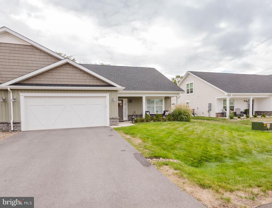 Welcome to this beautifully upgraded home in the desirable Cardinal Pointe Subdivision, offering a thoughtful layout,  modern finishes, and energy efficiency.  THIS HOME OFFERS OVER $55K IN UPGRADES FROM THE BASE HOUSE.  This home is built on one of the premier lots in the subdivision backing to woods for privacy. With 3 bedrooms and 3 full bathrooms, this home is designed for comfort and convenience. The main level features 2 spacious bedrooms, including the primary suite, and 2 full bathrooms, making single-level living a breeze.
Upstairs, a versatile loft provides a third bedroom, an oversized walk in closet, and a full bathroom, perfect for guests, a private retreat, or a flexible living space. The open-concept main area highlights a designer kitchen with upgraded cabinetry, quartz countertops, and stainless steel appliances, flowing seamlessly into the dining and living spaces for effortless entertaining.
Energy efficiency is built in with a high-performance 18 SEER, 2-zone Trane heat pump, delivering year-round comfort and cost savings. Outdoor living is equally impressive with a spacious extended concrete patio complete with a roof, offering the perfect setting for outdoor dining, relaxing evenings, or hosting family and friends — rain or shine.
Every detail, from the premium finishes to the energy-smart systems, has been carefully chosen to create a home that is as functional as it is beautiful. Conveniently located near commuter routes, shopping, and schools, this property offers the best of modern living in Hedgesville’s welcoming community.