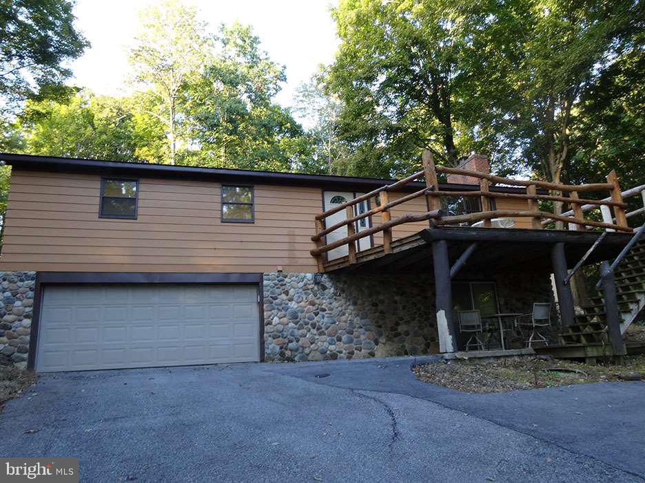 Ranch home or vacation.house has lots of updates throughout a must see. private setting.Front and back driveways.Walk out basement could be inlaw apt.all appliances convey.Private and peaceful wooded setting,great views.Owners can use lake and common areas.Larger than it looks from the outside.A MUST SEE. Only 35 mins from chambersburg,40 mins to Carlisle,50 mins from Hagerstown,md Watch the wild life. 3 brms 1 1/2 baths