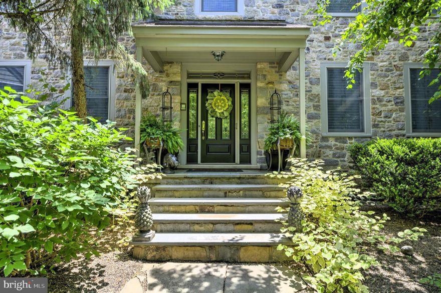 Welcome home to this exquisite, very secluded  4 Bedroom, 4 1/2 bath,  5056 sq. ft. Buckingham estate situated on 2.48 acres of lush, perfectly manicured property. Located in the much sought after school district of Central Bucks East,  this custom built home offers unparalleled luxury and privacy in the heart of Buckingham Township. From the moment you approach the circular driveway, the home's fir and cedar wood siding, meticuliously crafted exterior and incredible gardens create a lasting impression of timeless beauty and durability.  Designed to balance refined elegance and practical comfort, this home offers versatile living spaces including a 1 bedroom/ 1 full bathroom in-law/ Au-Pair suite discretely tucked away on the second floor!  
A bluestone walkway leads to the covered front porch.  Upon entering the grand two story foyer you will be impressed by the magnificent oak staircase and gleaming hardwood floors, setting the tone for the exquisite details found throughout. Hardwood floors continue through the formal living room, dining room and hallways. To the left , the formal dining room features pocket doors, crown molding, chair rail, recessed lighting and an elegant chandelier, offering a sophisticated setting for gatherings. To the right, the cozy living room  provides a quiet space for conversation. The adjacent solarium, bathed in natural light, offers a tranquil spot to tend to your plants or just sit and enjoy the view.  The phenomenal informal living spaces include a modern eat-in kitchen boasting an abundance of custom hickory cabinetry , granite counter tops, recessed and pendant lighting, upgraded stainless steel appliances, a reverse osmosis water filtration system, a large custom pantry and a back stair case leading to the second floor. A separate dining area with vaulted ceilings, expansive windows and French doors leads to an expansive multi-level Tech Bloc patio. This open floor plan gives the at-home chef plenty of work space to whip up all their culinary delights and is ideal for entertaining guests! Steps away, the spacious great room, with its handsome stone fireplace, custom oak built-ins and plush carpeting is the perfect place to settle in with a cup of cocoa on a cold winter's  night.
For those who work from home or desire a dedicated place to study, a private office with custom oak built-ins offers the perfect setting for productivity and focus. An immaculate oversized, heated 3-car attached garage with maximum storage, a powder room and laundry facilities complete the first level. The  primary bedroom suite offers amenities often found in luxurious spas! Pass through the French doors into a sophisocated, light-filled room enhanced by plush carpeting, crown molding, a ceiling fan and custom closets. The ensuite bath features two vanities, a large glass enclosed tile shower and a soaking tub to relax in after a hard day of work or play! There are 2 additional bedrooms, one with an ensuite bath, both with plush carpet, ceiling fans and tons of closet space and a 3rd full bathroom in the hallway. 
Discreetly located at the end of the corridor is a lovely in-law or au pair suite with a living room, kitchenette, bedroom and full bath with its own heat and water systems. Perfect for multi-generational households, out of town guests or the nanny. The full basement, currently being used for storage and a workshop can be easily converted into additional living space. The backyard sanctuary with its salt water pool, waterfall, lush greenery, meticulous landscaping , extensive hardscaping (Tech Bloc) and beautiful barbecue and seating/lounging areas make this the ultimate vacation destination for the lucky homeowners and their guests! You will never want to leave home again! Location, Location, Location!!! Close to Peddlers Village, New Hope, Doylestown, Lambertville, Philadelphia, New York, New Jersey.