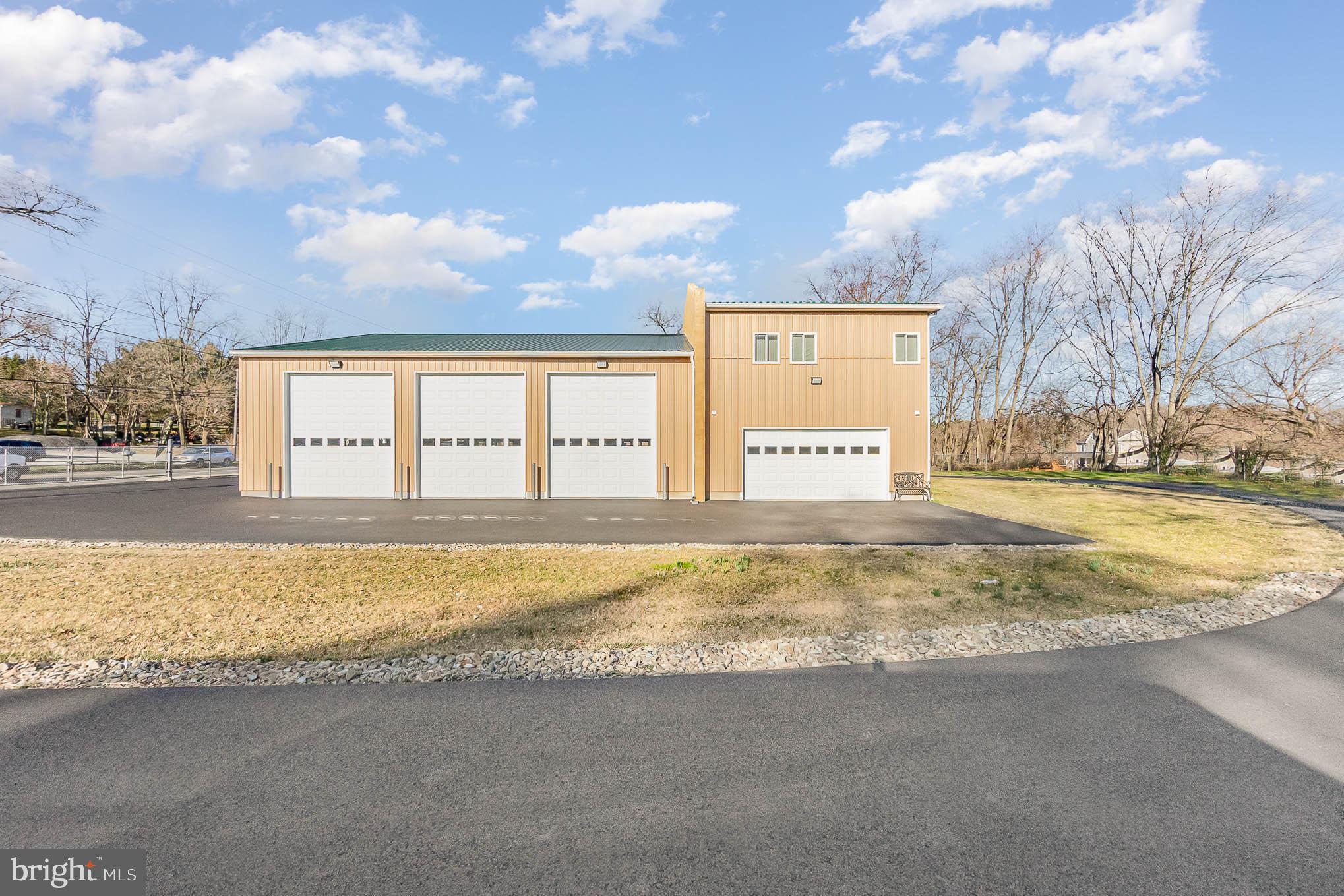 Live where you work in this commercially zoned shop/garage built in 2015 with fully functional upper-level apartment built in 2018.
SHOP/GARAGE FEATURES: 3000 Square Feet and 1.25 feet deep concrete slab with engineered footers for additional support, 16-foot-tall ceilings, wood roof trusses, block firewall, mocha tan metal siding and forest green metal roofing with gutter system. Running your business will be simple and efficient with the RapidAir compressor pipe deliver system, 600 Amp 3- Phase Electric, 2 York HVAC system units (plus one more for the apartment) and 6….. YES 6, 12' X 14' thermally insulated raised panel double sided steel garage doors with windows. ALSO INCLUDED, is an Atlas 10,000 lb, 2 post lift with 2' height extension and another 15,000 lb Atlas post lift. The shop/garage front also boasts 60” X 120” glass door front. The blacktop circle driveways make it easy to navigate the drive-through garages and the 6-foot-tall security gate with REMOTE CONTROL gives you peace of mind. Be open for business in no time because this shop/garage is up to code to include 2 handicap bathrooms and is insulated and has stucco block firewall. Plus, fully automatic Generac backup generator that powers the apartment and the office area, AND SO MUCH MORE!
UPPER-LEVEL APARTMENT FEATURES: No detail left unturned in this spacious and fully functional living space. From the moment you walk-up the extra wide staircase you feel the quality and workmanship throughout the home Apartment features, 2 bedrooms and 1 & 1/2 bathrooms with full laundry and laundry sink. As you enter the gourmet kitchen, you are greeted with high quality Kraftmaid Grandview soft close hickory cabinets, exquisite Bordeaux granite countertops, stainless steel appliances, center island, and large pantry. Stunning hardwood floors flow throughout the entire home. Bright windows and the deck offer relaxing views of the pasture where farm animals may come by for a visit. Take your morning coffee to the deck for the most gorgeous sunrises. Retire to your large master suite boasting, hardwood floors and walk-in closet with custom shoe storage. The master bathroom features walk-in shower, tile floor and double vanity with granite. Even the fixtures are high quality, from the Moen bathroom faucets, towel rings and grab bars and Kohler Archer medicine cabinets to the Hunter ceiling fans just proves only the best will do! Just when you thought that was it, the apartment also has its very own over-sized 2 car garage with a 16’ X 8’ thermally insulated raised panel double garage door and ample storage, including a large, full-wall coat closet and linen closet.
ADDITIONAL FEATURES INCLUDE: 1,000 gallon underground propane tank (OWNED) Over-sized restaurant quality septic system, 2…. Yes 2, laundry rooms, one for the apartment and one for the garage/shop, Sprinkler System for apartment, security system is hard wired, including cameras, control panel, keypad, siren, battery, motion detectors, door and window contacts and transmitters and outdoor wall lights, plus an additional 100 amp subpanel to power office, and apartment garage. The shop/garage and the apartment are on 2 SEPARATE ELECTIC ACCOUNTS. Come see for yourself. Schedule your tour today.