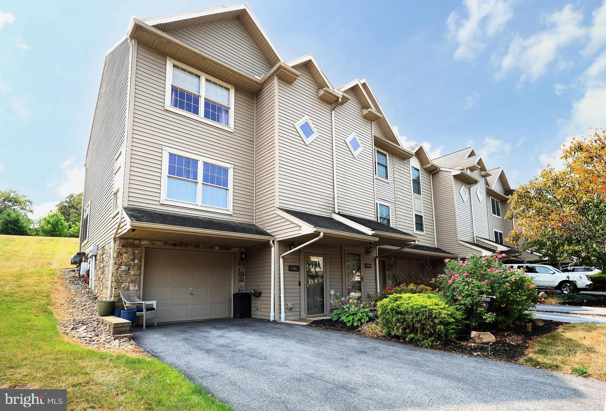 OPEN HOUSE - Sunday, September 14th, 11:00 AM - 12:30 PM. Move-in Ready End Unit in Village Square at Oakwood! Welcome to this beautifully maintained 3 bedroom, 3.5 bath townhome. Step inside to discover light-filled rooms, wood floors, and 9' ceilings that create an open feel. The kitchen boasts newer appliances, including a gas range, plus a large sink and a convenient pantry. The adjoining, spacious living room invites relaxation with expansive windows and sliding glass doors that open to a quaint deck. The main level is complete with a half bath that adds everyday practicality. Upstairs, the spacious primary suite impresses with vaulted ceilings, dual closets, and an updated private bath. A second bedroom with its own full bath and a convenient laundry area completes the upper level. On the first floor, a cozy third bedroom with an attached full bath offers a perfect private retreat for guests or family. With every bedroom featuring its own full, private bath, this home offers the ultimate comfort and convenience. Here you can enjoy low maintenance living with an HOA that takes care of lawn care and snow removal. Additional highlights include natural gas heating, new central air system (2024), a 1 car garage, and nearby CATA bus service. Whether you’re searching for a full-time residence or the ideal football weekend home, this townhome is perfectly located just minutes from Penn State, shopping, and restaurants. Don’t miss this exceptional opportunity to own a move-in ready home in a prime location!