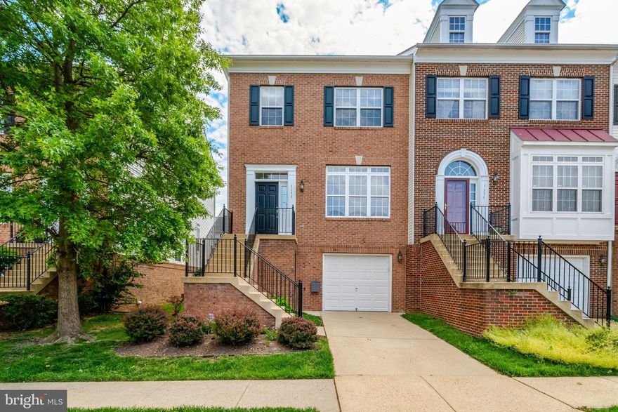 Impressive end-unit townhouse showcasing significant recent upgrades including a newer tankless water heater(never run out of hot water), newer Carrier HVAC units, a newer roof, and brand new carpet throughout! This elegant home features a distinctive brick front, 3-level bump-out, and a 1-car garage. Inside, discover hardwood floors on the main level and a welcoming family room with a cozy fireplace adjacent to a huge, upgraded kitchen. Culinary enthusiasts will love the stylish matte white GE Café range, Bosch dishwasher, and vent-out range hood. A bright breakfast nook with deck access is ideal for entertaining. Retreat to the oversized primary bedroom with a vaulted ceiling, walk-in closet, sitting area, and luxurious en-suite bathroom. The spacious, open walk-out basement leads to a fully fenced yard. Enjoy the convenience of a 1-car garage with workspace and storage, plus extra driveway and common area parking. Commuters will appreciate the quick 5-minute drive to the Metro and easy access to all major routes. Enjoy being adjacent to a large park and close to Springfield Town Center, shopping, and dining, with the VRE, 495, 395, and Fairfax County Parkway just minutes away.