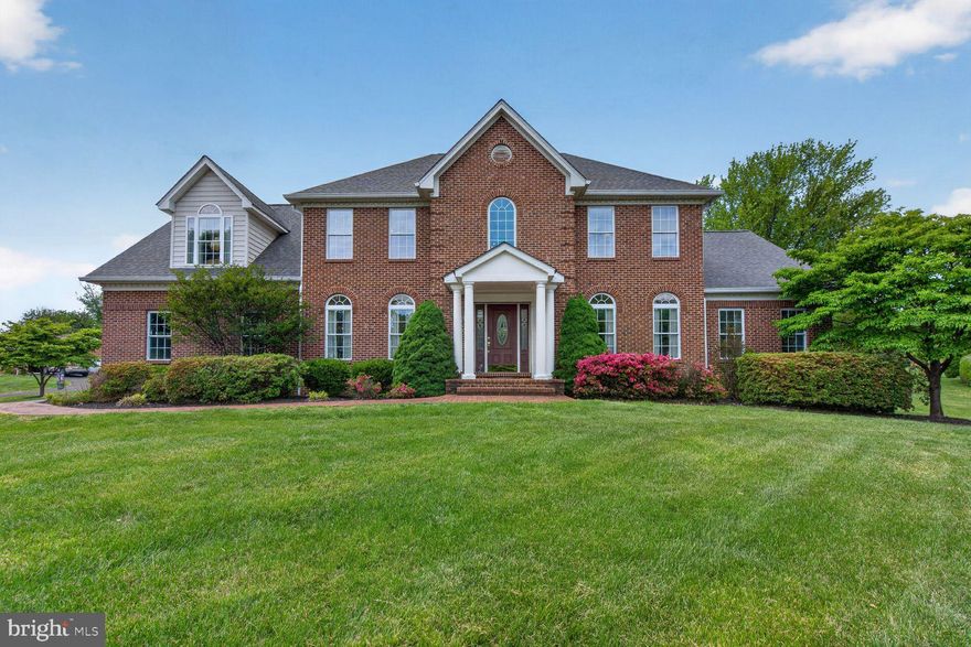 Beautiful & professionally landscaped nearly 1.5 acre lot in a community of custom built homes in Haymarket area.  This home w/five bedrooms & 5.5 baths offers convenient ML Primary Suite, w/full bath  jetted soaking tub & separate shower & walk-in closet,  next to generous family room and eat in kitchen.   Kitchen offers lots of natural light w/quartz counters & subway tile, updated stainless appliances & ceramic floor extending to walk-in pantry, 1/2 bath, laundry & entrance to 2 car garage.  ML includes formal living & dining off 2-level foyer, w/wood floor.  The covered porch next to breakfast area provides a quiet retreat to have a meal or sit & relax or have fun w/family & friends in backyard.  Detached garage provides privacy plus it's wonderful storage for vehicle & equipment.   2nd levels offers 2nd Primary Bedroom Suite, w/Soaking tub, separate shower & walk-in closet,  BR 2, 3 & 4 on 2nd floor each have ceiling fans & light kits.  BA 3 & 4 on upper level each have tub & shower combo.  Bonus room over garage wing can be used to relax & it includes kitchenette with 2 burner stove, refrigerator, cabinets & eating space.  Lower level  offers 5th BR & BA, large rec room with pool table, office, large walk-in closet, utility room & unfinished storage area.  Exit to outside is via walkup stairs from Rec Room.  Roof replaced 2016  w/25   -30 year warranty, kitchen appliances, counter top & floor have been replaced, heating & air conditioning units & hot water heater have been replaced.  Less than 5 miles from shopping, community library,  commuter lot, playgrounds, churches, & I-66.