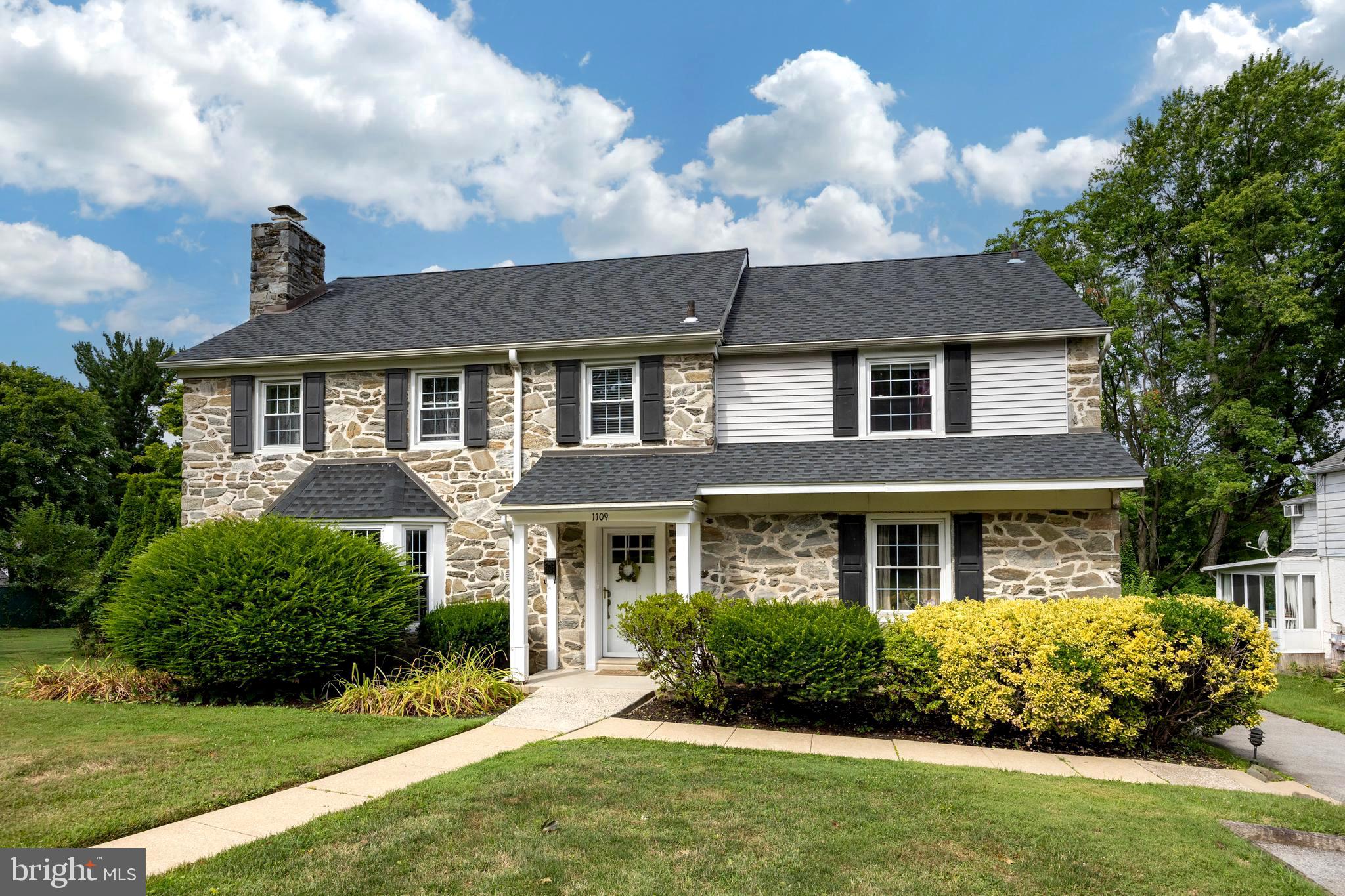 Welcome to 1109 Ashton Road, Wynnewood, PA! Nestled in the desirable Wynnewood Valley neighborhood, this charming five-bedroom Mainline Stone Colonial offers timeless elegance and modern amenities.
Step inside to discover gleaming hardwood floors and recessed lighting throughout. The spacious living room, featuring a cozy wood-burning fireplace, is bathed in natural light, perfect for relaxing or entertaining. The first floor includes a convenient home office, ideal for remote work.
The kitchen has been updated with a contemporary stainless steel appliance package, breakfast bar, and sleek cabinets and countertops. Adjacent to the kitchen is an additional living area with a vaulted ceiling and skylights. Connected to the dining area and living room, a side porch offers an ideal space for entertaining guests.
Upstairs, you'll find an updated primary bedroom with an en suite bathroom. Also on this level are three additional bedrooms and a full bath. The third floor offers a versatile fifth bedroom or extra living space finished to suit your needs.
The home features a finished lower-level basement with a powder room, laundry area, plenty of storage, and additional living space. An entertainment bar adds a stylish touch for hosting gatherings.
The attached two-car garage provides ample parking and storage. Outside, enjoy a beautiful, level lot with a fenced-in, tree-lined in-ground pool, offering plenty of privacy and perfect for summer fun.
This property is part of the award-winning Lower Merion School District and is convenient to local restaurants, Suburban Square, schools, and is just a five-minute walk to the train station and plenty of shopping, including Whole Foods.
Don't miss out on this exquisite home in a prime location!