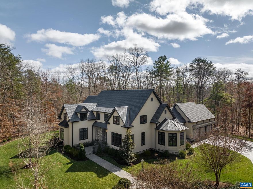 Exquisite French Provincial masterpiece offering luxury and comfort! The finest in custom finishes throughout this architectural gem!  Enjoy the best of main-level living with sumptuous primary suite, adjacent study with fireplace, two spacious walk-ins with custom shelving, and private access to the bluestone patio. Recently and completely renovated gourmet kitchen will satisfy the most discerning chef and features top-of-the line appliances, custom cabinetry, and exceptionally crafted details. Relax in the soaring great room with beamed vaulted ceilings & stone fireplace or flow effortlessly out the French doors to the trellised bluestone patio. Entertain in the sun-drenched dining room or enjoy intimate dining or lounging in the semi-octagonal conservatory/breakfast room. Thoughtfully designed mud room, laundry room, and desk/workspace complete the main level. Three additional bedrooms upstairs, each with attached full baths and ample storage areas. Second floor loft overlooks the great room and is an ideal workout room or private work area. The gardens and outdoor spaces are immaculate and perfectly manicured. New solar, whole house generator, heated exterior bluestone walkway/front entryway and so much more! Must see!,Fireplace in Great Room