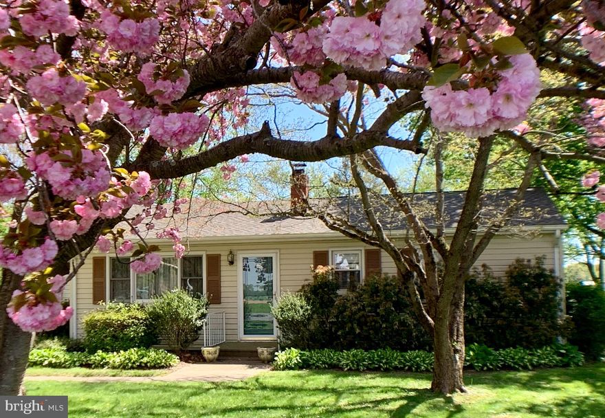 Well-maintained classic rancher with sweet curb appeal, and easy access minutes from Chestertown.  Plenty of room -  just short of an acre - with cherry, dogwood, and maple trees and an established asparagus/vegetable patch with an underground sprinkler system. The double garage includes a Craftsman ride-on mower in good condition to help with property maintenance.  To soak in the sun and rural splendor there is a 336sf sunroom with double-hung (tilting) windows which was added in 1995 and a new roof was added in late 2016.  The sunroom also includes a Fisher cast-iron wood stove with accessories! The sliding doors from the kitchen/dining room create an open-plan feeling and you have a separate living room with built-ins,  wood paneling, and beautiful honey oak hardwood floors. There are also hardwood floors in the bedrooms and dining room; all in excellent condition.   In the kitchen, upgrades include quartz countertops, double stainless sinks, a 6-burner propane stove with griddle, and a stackable washer and dryer.  The bathroom received a recent upgrade including a Bath Fitter tub.  The oil boiler furnace has just been serviced as it is every year,  and the oil tank refilled. The water softener is also serviced annual service. Septic was last pumped 5 years ago and the home has only been seasonally occupied on an infrequent basis. Also lots of room for crab fests and storing your boat  - come and make it yours.