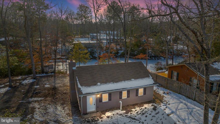 Welcome to your little getaway! This beautifully renovated 2-bedroom, 1-bathroom home is nestled in 
 the serene water-oriented community of Placid Bay, which offers access to the Potomac River and several tranquil lakes perfect for fishing, swimming, and kayaking.

Situated on the picturesque shores of Lake Placid, this home boasts its very own private dock, refurbished in 2024, providing the ideal spot to launch a kayak, cast a line, or simply enjoy the peaceful water views.

Inside, you'll find a thoughtfully updated space with luxury vinyl plank (LVP) flooring, a wood-burning fireplace, and modern conveniences like a tankless water heater. The 2017 renovations included a new roof ,new HVAC system and ducting, and new windows . In 2023, the home was connected to public sewer for worry free convenience.

Whether you're seeking a year-round residence or a weekend escape, this property delivers the perfect combination of comfort, charm, and water-oriented living. Don't miss your chance to experience this lakeside oasis—schedule a showing today!

Key Features:

Renovated in 2017: New roof, HVAC, and interior updates, all new windows
Public Sewer Connection: Upgraded in 2023
Private Dock: Refurbished in 2024, offering direct access to Lake Placid
Tankless Water Heater: Energy-efficient hot water on demand
Wood-Burning Fireplace: Cozy ambiance for cool evenings
Community Amenities: Voluntary association with access to the Potomac River and multiple lakes for outdoor activities
This home won't last long—make it yours and start enjoying lakeside living today!