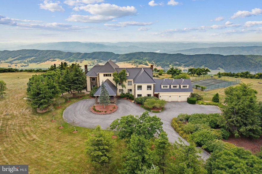 We are excited to reintroduce this stunning Virginia mountain estate to the market.  (Previous Buyer backed out due to personal reasons.)   Discover the pinnacle of luxury and privacy in this stunning 27+ acre estate, the highest home in Virginia.  The home is surrounded by 360 degree views of the Blue Ridge & Allegheny Mountains.  

“Higher Ground” is just 20 minutes from the Omni Homestead Resort and  about a mile from the Hot Springs airport with a 5600-foot airstrip (currently being renovated).    This elegant property features 8 bedrooms, 6.5 bathrooms, and 10,300 square feet of living space.  Enjoy breathtaking Mountain Views from nearly every room, and unforgettable sunsets from the terraces.  Outdoor amenities include a heated pool, and skeet shooting range, while the property offers ultimate privacy surrounded by thousands of protected acres of the state park and the Nature Conservancy.   

A 2024 elevator, Authentic Finnish Harvia Sauna, first level in-law suite, 5 custom mahogany doors, and a 3-car garage add to the luxury.  Higher Ground Custom Estate is ideal for families, executives, private jet owners, and those seeking a truly private retreat.  

The estate's location in Hot Springs, VA, offers a wealth of activities at the Omni Homestead Resort including skiing, 2 championship golf courses, trails, and natural hot springs for relaxation and discovered in the 1700s.   The property has been impeccably  maintained by a Caretaker Couple, who would be interested in staying on should the buyers be interested.