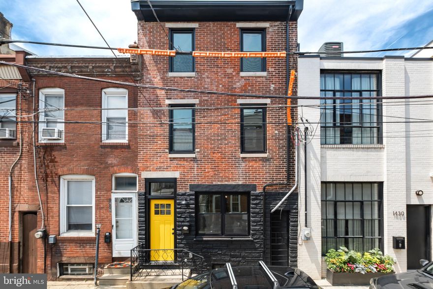 Welcome to Fishtown, 19125! This 3 story brick front home has been completely renovated and located in the heart of all that Fishtown has to offer.  Upon entering you will be greeted with an open concept main floor complete with wide plank wood flooring, neutral paint colors and recessed lighting. The living area boasts a welcoming electric fireplace tastefully accented with shiplap and wood mantel.  Continue through to the modern kitchen where you will find white shaker cabinets, quartz countertops and tile backsplash. The second floor has 2 bedrooms, 1 full bathroom and separate laundry room.  Head up to the third floor where you will find the main bedroom complete with a walk in closet and en-suite.  Enjoy the luxury of a finished basement to utilize for whatever your heart desires. The rear yard is complete with privacy fencing and new sodding , providing the perfect blank canvas for your future oasis. Additional bonuses include a  2-zone HVAC system and private side alleyway. Schedule your showing to see all that Oxford St and Fishtown has to offer!