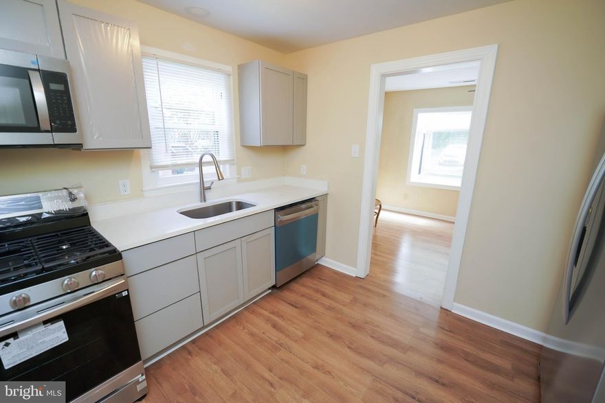 Turn-Key - Updated and Upgraded - 2BR rancher w/ a roomy yard. New roof, New LVP flooring throughout, New HVAC, New kitchen and bath, New appliances, new laundry room. Down a residential side-street in Fruitland, just minutes to the bypass, grocery and retail shopping, unique events at  Salisbury University, TidalHealth/PRMC, and local arts, culture, dining, and community get-togethers in Downtown Salisbury on the Wicomico River. Tax records don't reflect the addition of the laundry room. Sizes, taxes approximate