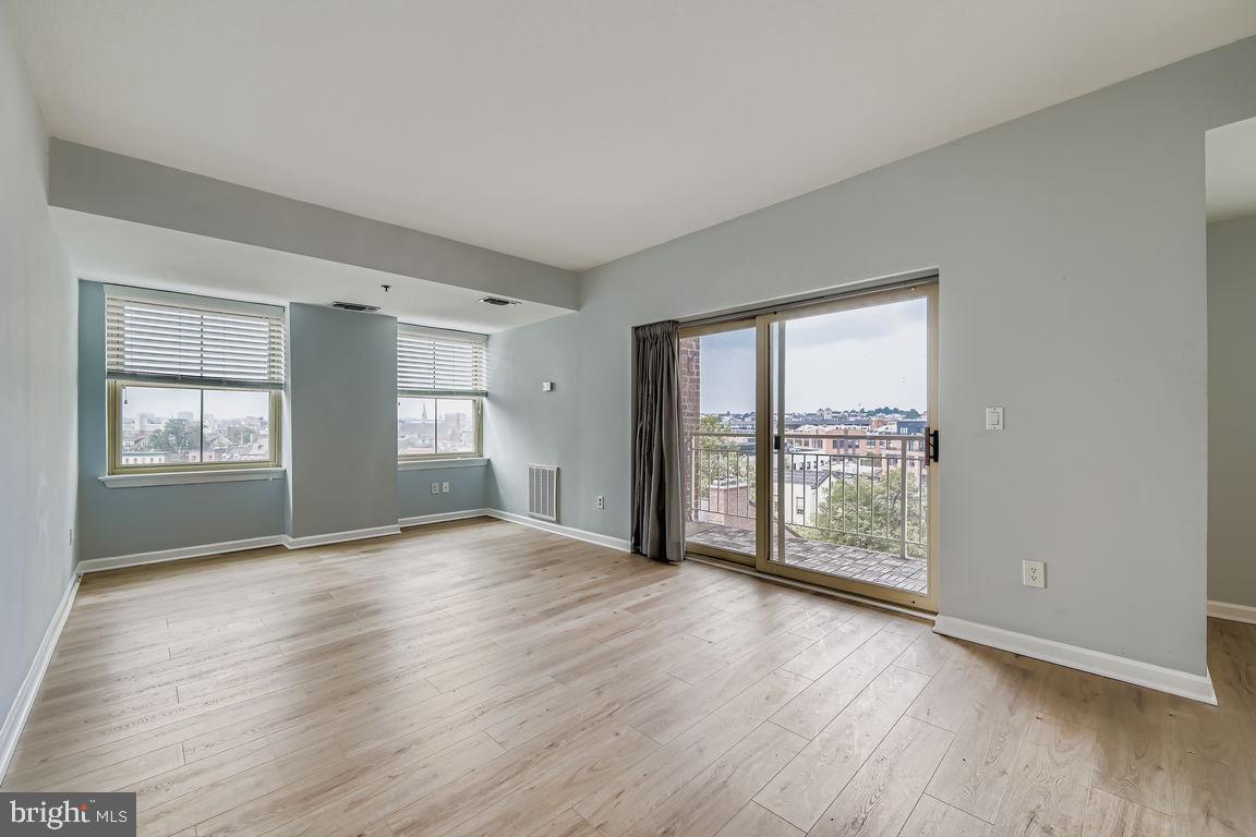 Beautiful upgrades just finished!! new floors and baths !!This amazing sun filled unit has the unique advantage of having both East and West exposure. You can sit on your 6th floor deck and enjoy peacefully or with friends. The residence has 2 large bedrooms with great organizing features and views with lots of sunlight. the owners suite has a separate soaking tub and separate shower. The unit not only has a large laundry/storage area plus a separate storage unit for your use, also 2 parking spaces plus parking fors guests. The building has a 24 -7 front desk , fitness center plus an outdoor pool with a hot tub and entertaining space for you and friends. Enjoy the Fells Point restaurants and activities plus walk along the waterfront promenade and it will certainly add to your well being. Open Sunday 8/10 12;00 to 2:00. join us.