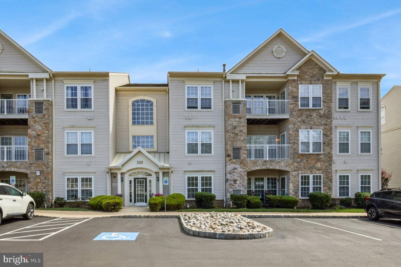 Welcome to Forest Ridge, an exclusive 55+ community where the active adult lifestyle is enhanced by modern amenities and low-maintenance living. This 2nd floor, 2-bedroom, 2-bathroom unit is enhanced by 9-foot ceilings, recessed lighting, neutral paint colors, hardwood flooring and is truly move-in ready! A foyer entry with double closets leads to an open concept living and dining room area--enhanced by a wall of windows--filling the space with an abundance of natural light. A centrally located kitchen features upgraded 42" cabinets with crown molding, Corian countertops, tile backsplash, a breakfast bar, large pantry & access to the convenient in-unit laundry area. All appliances are included in the sale. The sunroom/den/breakfast room is a delightful spot to enjoy your morning coffee while providing access to the private balcony. Retreat to the spacious primary bedroom, featuring walk-in closets and a private ensuite bathroom with tile flooring--complete with a double vanity, linen closet and oversized shower. An additional well-appointed bathroom is conveniently accessible from both the secondary bedroom and living room area. Don't miss the recently updated utilities--new furnace installed in 2023, and new hot water heater installed in 2022. The dryer vents were also just cleaned in 2024. Common area/grounds maintenance, landscaping, snow removal, and trash removal are included in the monthly association fee. The community clubhouse is a hub of activity with a meeting room and event space, fostering an active and social lifestyle for residents. Pets are welcome. Shopping, dining, nightlife and community events are just minutes away on route 611 in Warrington and in historic Doylestown Borough. Book your private showing today!