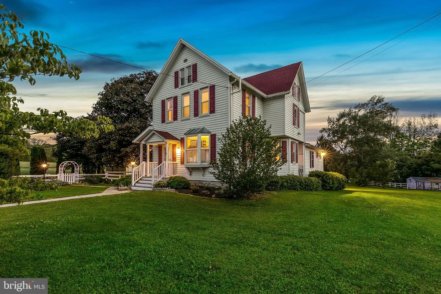 COMING SOON - Beautifully rehabbed farmhouse on a sun-lit double lot.  All of the major systems have been replaced and enhanced with green living in mind.  Take advantage of the fully owned solar panels which can produce approximately $1500 in savings each year. Hardwood floors throughout 2018 and staircase refinished. Partial kitchen remodel 2018 adding a dishwasher and granite counters.  Amazing first floor primary suite with tons of natural light.  HUGE walk-in closet with custom built-ins. Fully renovated master bath 2019 with double Roman shower and frameless low maintenance treated glass, quartz countertops. Upstairs full bath was remodeled in 2018 with matching Kohler Artifact fixtures, quartz countertops, and semi-frameless bypass glass doors and added a huge custom linen closet.  Third floor with additional rooms that can be finished any way you like for more bedrooms or a private office.
Sunporch features Trex for low maintenance upkeep. Roof 2012, HVAC 2018 Mitsubishi mini splits installed for efficient heating and cooling. 2018 basement sealed and insulated with vapor barrier installed.  New well in 2018 that pumped 10gpm at time of installation as well as adding a pre-filter and new additional pressure tank to go along with the neutralizer and water softener.   Whole house propane generator.
The barn features a 60-amp service and 220-volt for electric car charging in the oversized bay.  All outbuildings resided and re-roofed with corrugated metal to be maintenance free for years to come.  Solar 2019  11.7 kilowatt-hour system and installed on the barn roof designed to produce 50% of the property's electric use with using the car charging station or 75% without.  Net metering with BGE so if you produce more energy than needed you receive a credit and can use the energy later.
You won't find a more lovingly maintained home than this one.  Detailed original mouldings throughout. Immense amount of storage. Raised garden beds and chicken coop for homestead living.  Minutes to 795, 20 minute back road trip to Hunt Valley, quick trip for groceries, and all the restaurants and shops on historical Main Street.