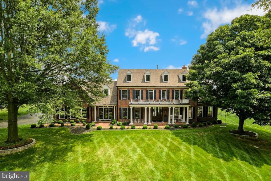 Offering the finest in contemporary conveniences with elegance and grandeur, yet intimate and warm, prepare to fall in love with 9101 Goshen Valley Dr.  This gorgeous and stately brick-front home is prominently sited on a quiet street in the highly sought-after Greenhills Farm community in Gaithersburg, MD with six bedrooms  

A double door entry welcomes you to the main level with an open and airy floor plan.  Feel yourself drawn into this home’s enchantment as it enthralls and entices you with its modern yet slightly rustic allure.  Exquisite taste radiates throughout with attention to architectural detail.  Premium hardwood flooring is enhanced by abundant bright windows, recessed lighting and exposed wood beams.
The kitchen is a chef’s dream and the heart of the home.  With views of the gorgeous backyard, It features a large center island, cabinetry adorned by granite countertops and a herringbone tile backsplash, high-end stainless-steel appliances for all your culinary endeavors, and a breakfast nook backing to a wall of windows.
The family room is the perfect place to retreat to after a long day with a cozy wood-burning fireplace for everyone’s enjoyment.  The main level also includes a large sunroom, completely integrated with the rest of the home offering a variety of uses, a huge office perfect for hybrid or work-from-home professionals, a separate living room, dining room, laundry facilities, and a powder room.
Upstairs, the primary suite will impress you.  Boasting a sitting area, an enormous dressing room, and a luxurious primary bathroom with floor-to-ceiling tile, wall-to-wall double vanity, free standing tub, and a large shower stall with dual shower heads and a rain shower feature.
Three more generous bedrooms are served by a well-appointed hall bathroom and a fifth bedroom with its own private bathroom passes through to a large study/lounge room with an additional stairway.

The fully finished lower level offers tons of additional space for living, recreation or home entertainment and a bedroom provides family and guest accommodations, served by a full bathroom.

The backyard is your very own private and personal retreat to enjoy all year.  The expansive flagstone slate patio is ideal for outdoor grilling, dining, hosting gatherings, or relaxation.  Tons of yard space and an outdoor basketball court enhance the property and create the perfect atmosphere and setting for all of life’s finest moments.  Host parties, intimate gatherings, and enjoy silent retreats all within your own home.  Set in a serene and welcoming neighborhood with mature trees and beautifully maintained properties, this home has so much to offer inside and out.  Your treasure hunt ends here!  9101 Goshen Valley Dr is a dream come true.  Don’t miss this fantastic opportunity to make this your forever home today!