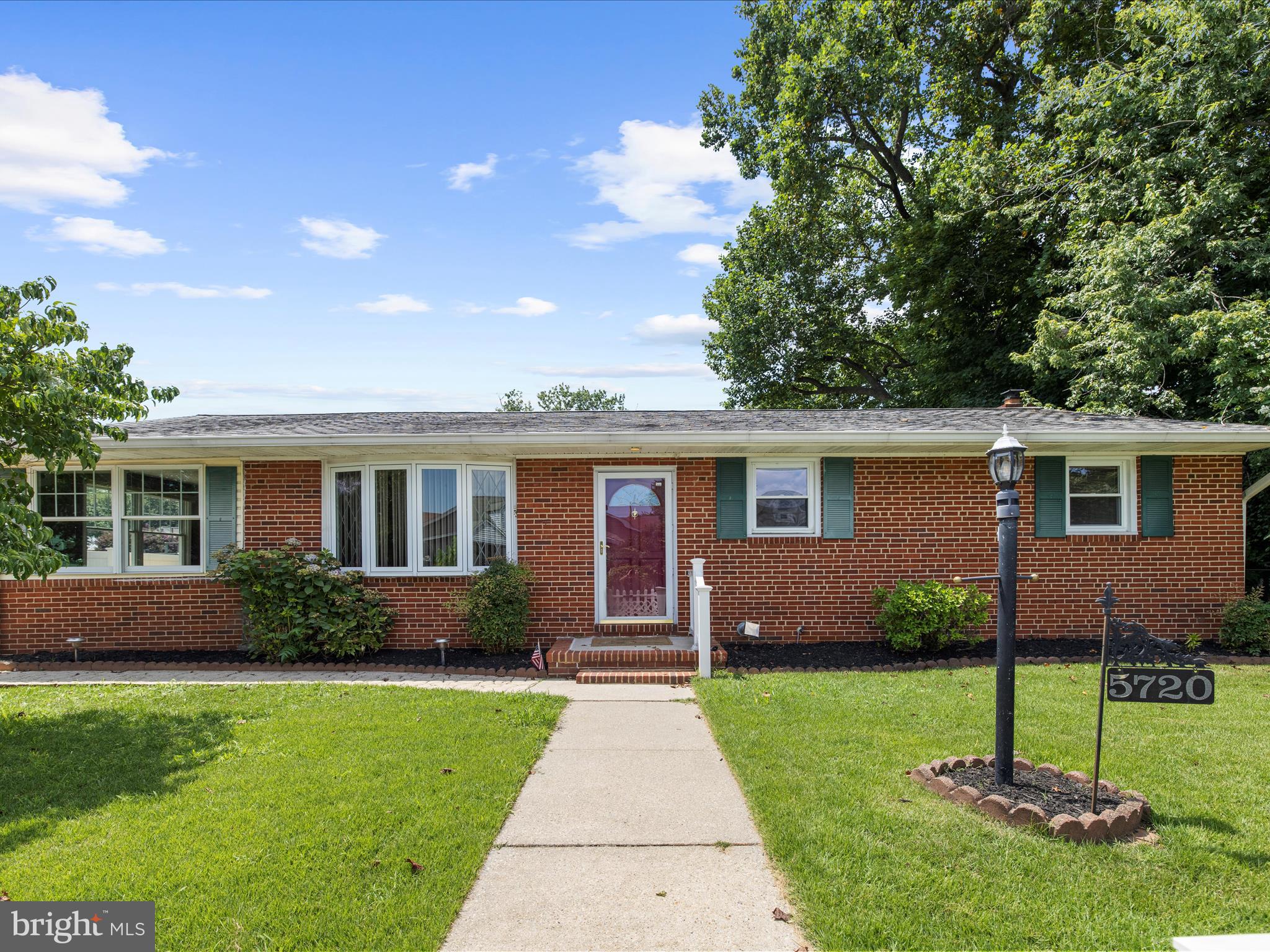 This brick rancher is bursting with charm and character, offering timeless appeal and easy living all on one level. From its inviting front yard to its warm, welcoming interior, the home exudes personality and comfort throughout. Nestled on a spacious, well-maintained lot with mature landscaping and plenty of outdoor space, it’s perfect for relaxing, entertaining, or future expansion. A rare gem with classic style and room to make your own! First floor offers three generous size bedrooms and one full bathroom. Through the updated kitchen is the expanded sunroom that is perfect for a formal dining/sitting area. Off the back of the house is an enlarged screened in porch. The lower level offers a finished rec-space with a pellet stove and an abundance of storage and second full bathroom. Upgraded gutter guards for maintenance free living.