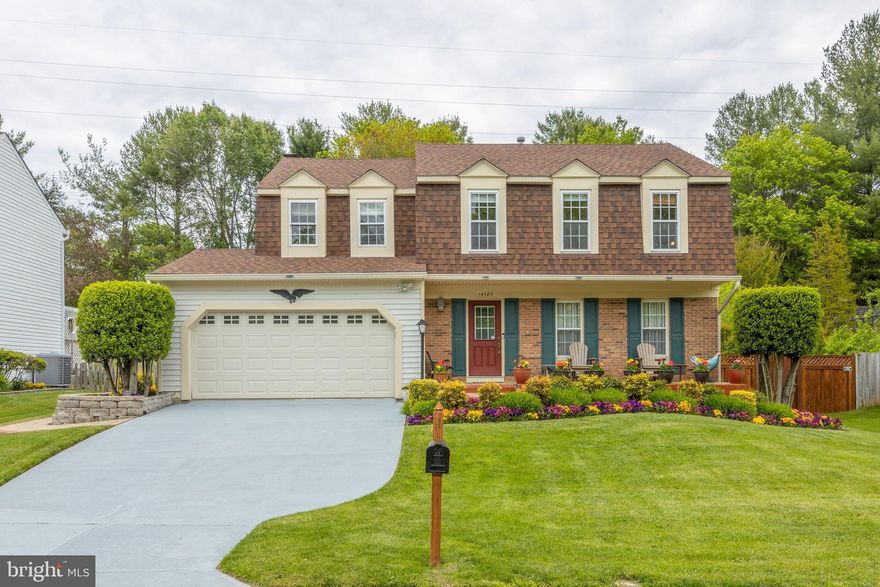 HURRY!!  This lovely colonial will take your breath away. Attention to detail prevails throughout the house. Your first glimpse of perfection is the lovely front porch of stamped concrete which is hugged with flowers and flanked by a beautiful yard. The sidewalks are stamped concrete and extend around the house to the back yard where you'll find a large storage shed, a deck and a beautiful lawn.    Upon entering your home, you notice the lovely hardwood flooring which encompasses the entire main level.  The formal living room features crown molding, dining room has chair rail and crown molding.  Wander into the custom kitchen, upgraded granite  counter tops, stainless steel appliances, upgraded kitchen cabinets, and a garden window over the sink which looks onto the large back yard.   The family room has built-in bookcases framing the brick, gas fireplace.  In  this welcoming room you immediately notice all the natural light and how cozy it is.  A spectacular all-weather sun-room is off the kitchen, it is heated, has a/c, ceramic tile flooring and leads to a  low maintenance, composite Trex deck just waiting for your BBQ. Heading up upstairs to a large landing with hardwood floors, 4 nice size bedrooms and 2 full bathrooms, one of which is the custom-built master spa- bathroom we all yearn for.  It features recycled glass counter tops, a shower with multiple jets, beautiful tile and vanity.  Jump to the basement where you have custom, built in storage cabinets, this is the perfect office, playroom, tv or game room.   There is also a finished bonus room and the large laundry room with more shelving for storage and another awesome upgraded full bathroom.   Just a few of the improvements done:  New ROOF   30 December 2014, SIDING replaced  10 April 2016 14. SUNROOM (all season)   March 2012, WINDOWS replaced   4 June 2002, SOLAR POWERED motion lights give 360 coverage of the house. RADIANT HEAT BARRIER (in attic)   March 2011, SMOKE/CARBON MONOXIDE ALARMS   24 March 2017